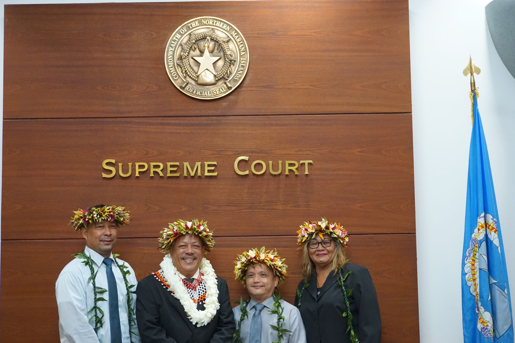 Tinian Mayor Edwin P. Aldan, 2nd left, and the Tinian Municipal Council members — Estevan Pangelinan Cabrera, Joseph Romaldo Evangelista Santos and Ana Marie Cruz San Nicolas —  smile for a photo after  being sworn into office on Monday, Jan. 9, 2023 at the CNMI Supreme Court in Susupe.