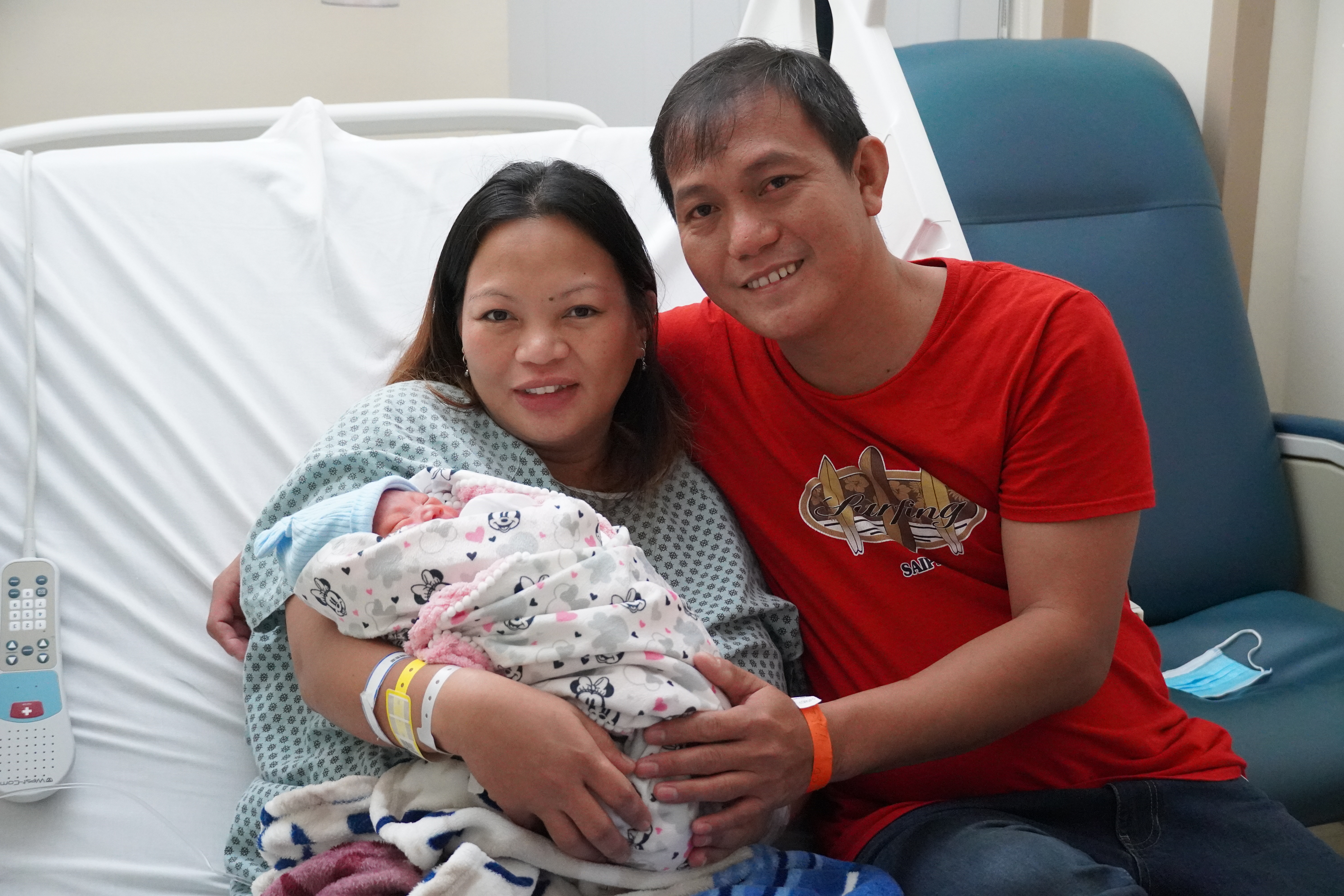 Happy couple Veronica Dacasin, 39, and Carlo Doria, 39, pose for a photo with their newborn son, Denzel Carl, the first baby born on Saipan this new year.