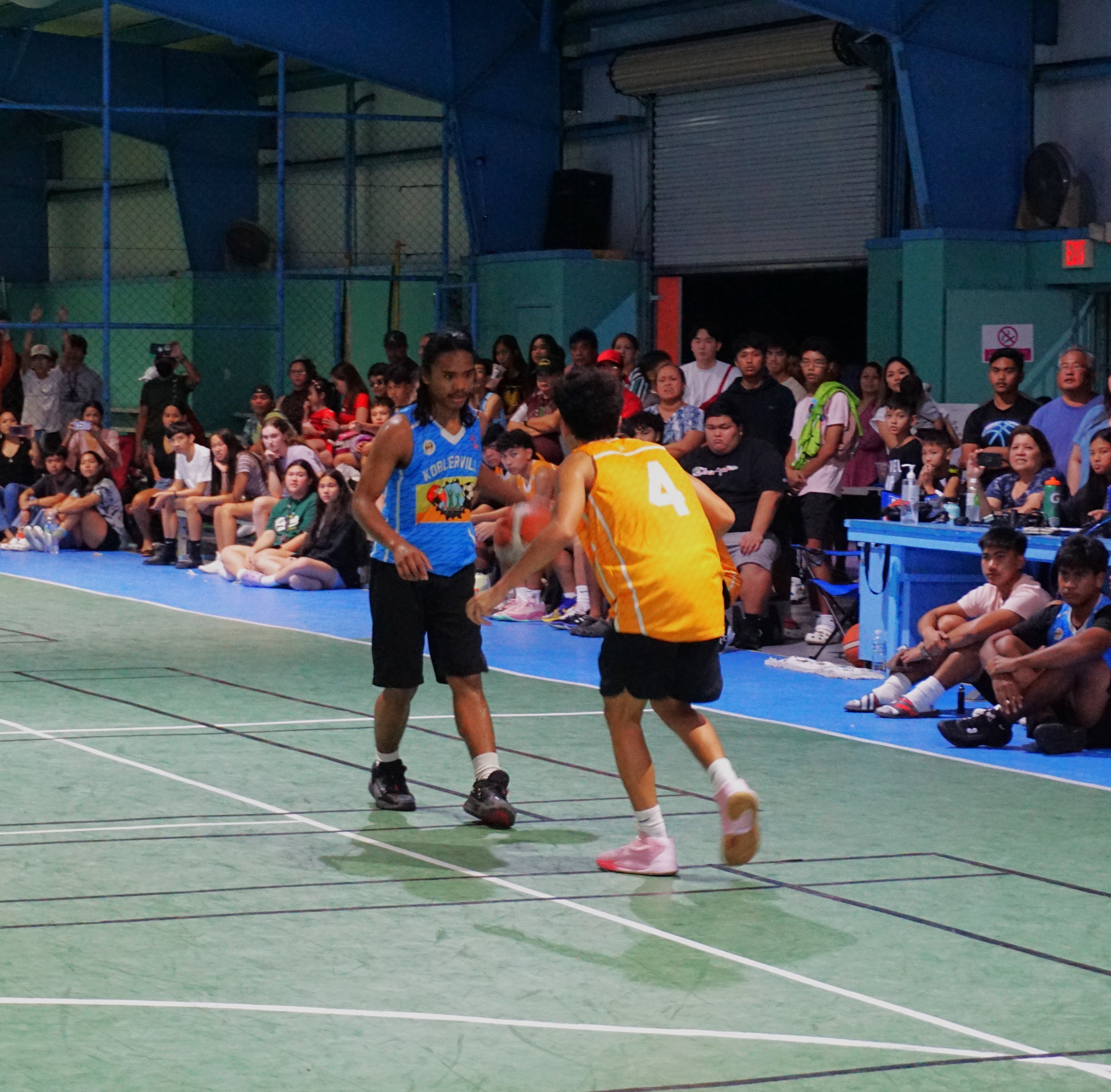 Koblerville's Airson Atan sizes up his defender during the U18 boys division championship game of the 2022 Marianas Village Pride Basketball League on Sunday at the TSL Sports Complex.