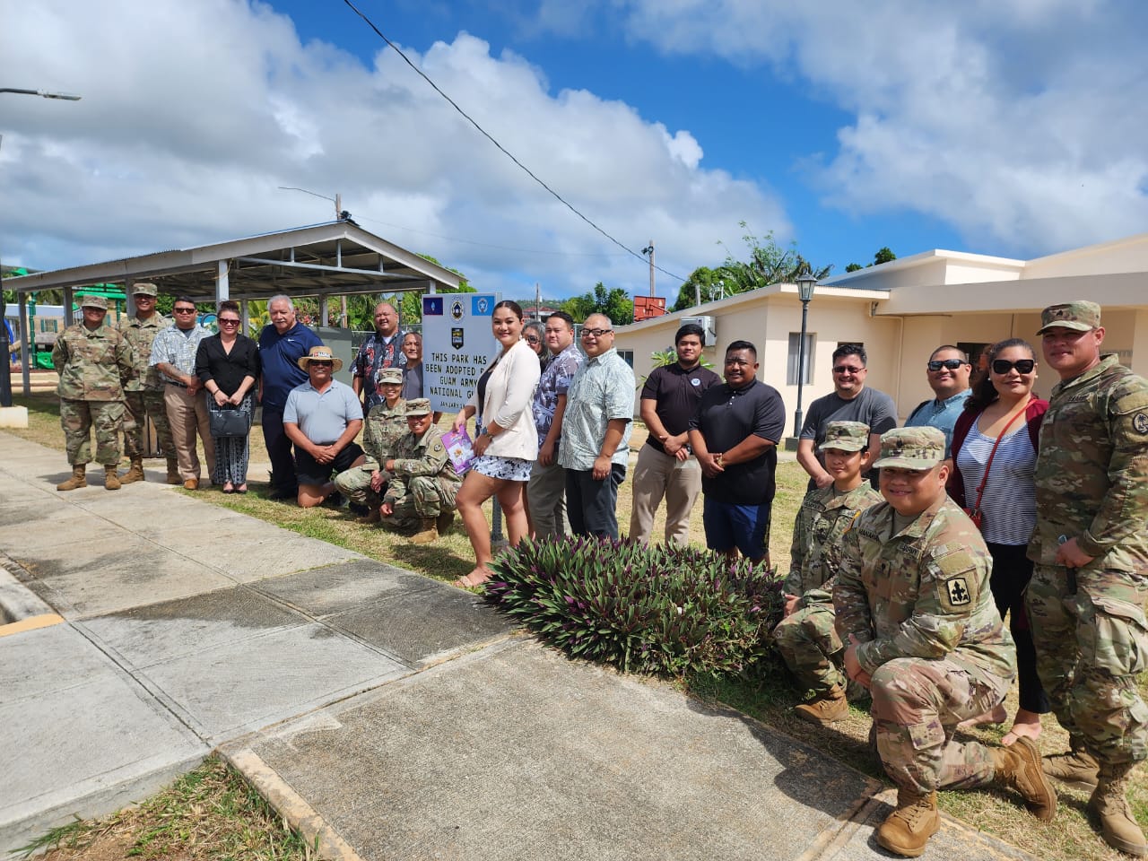 Lawmakers pose for a photo with Saipan Mayor RB Camacho and officers and members of the U.S. Army National Guard at San Vicente Central Park on Sunday.