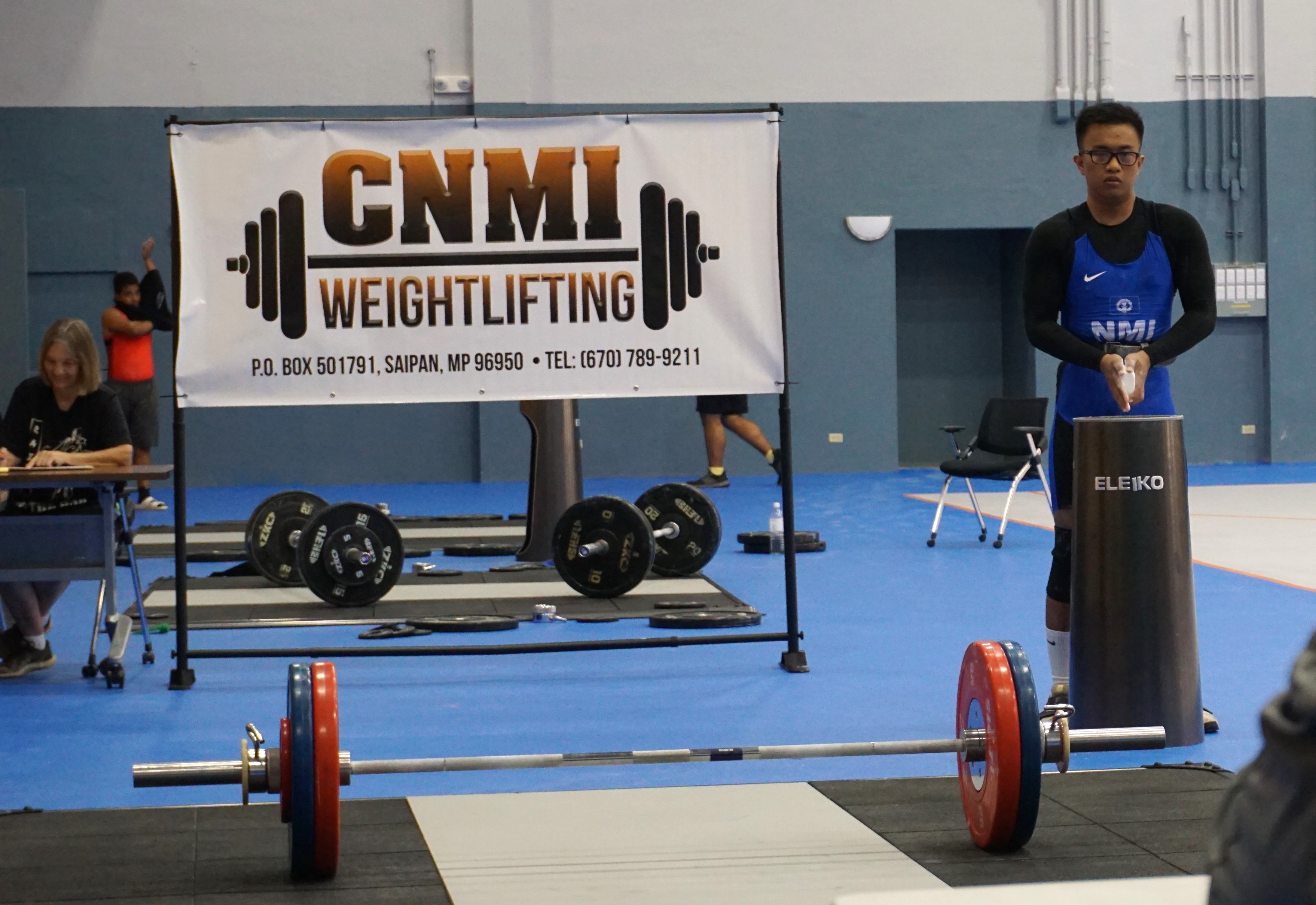 Emmanuel Aquino prepares for his lift during the CNMI Weightlifting qualifier event Saturday at the Ada gym.