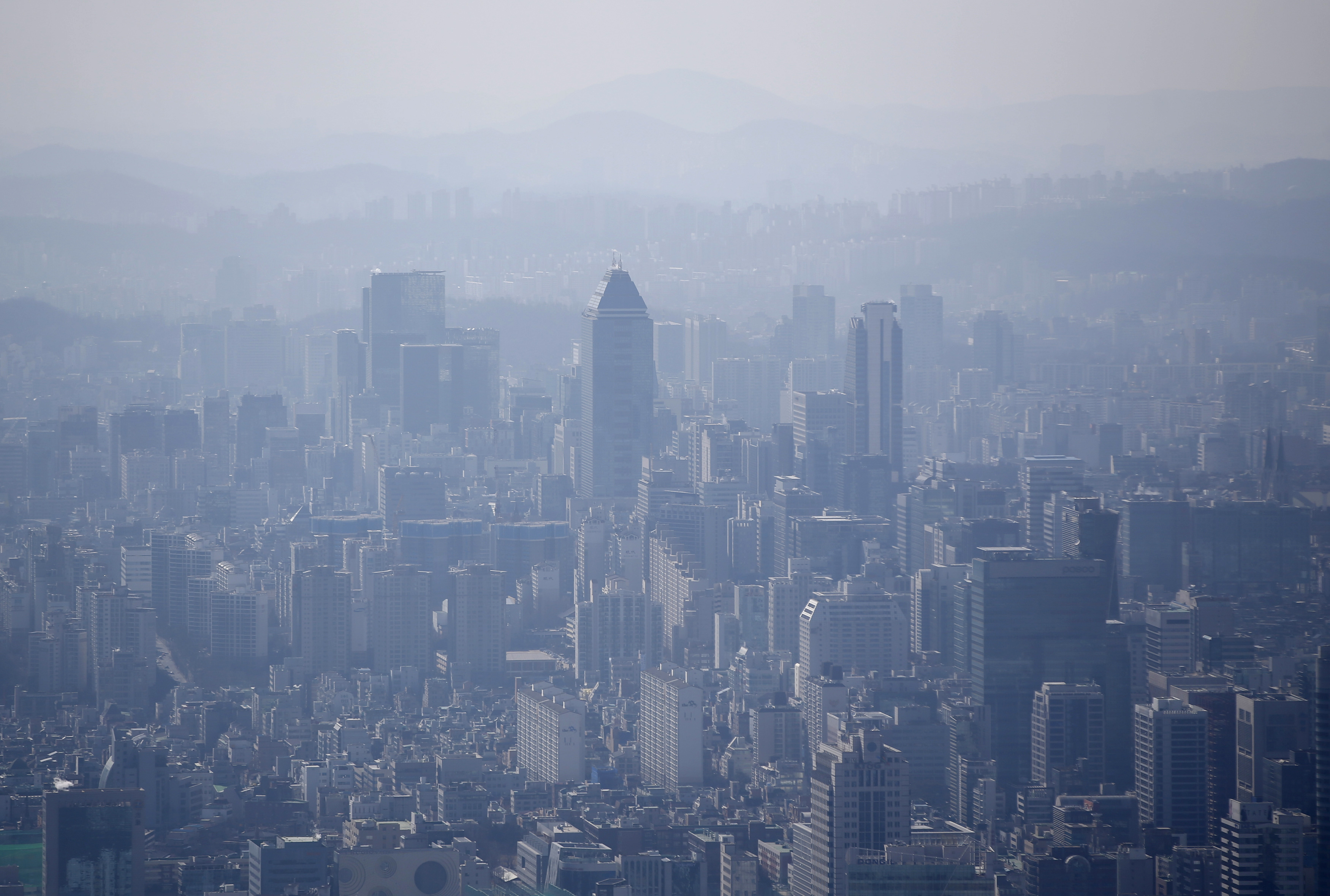 The skyline of central Seoul is seen during a foggy day on March 4, 2015.