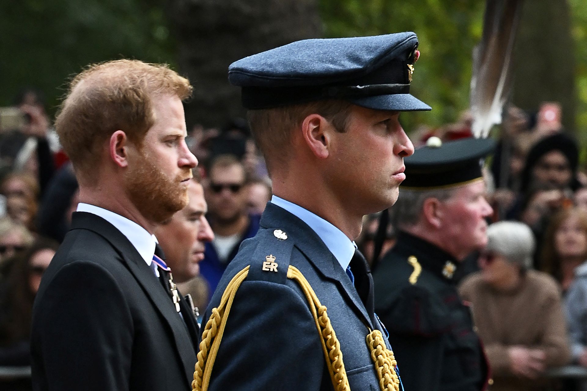 Britain's Prince William, the Prince of Wales, right, and Britain's Prince Harry, the Duke of Sussex follow the coffin of Queen Elizabeth II, as it travels on the State Gun Carriage of the Royal Navy, from Westminster Abbey to Wellington Arch in London on Sept. 19, 2022, after the State Funeral Service of Britain's Queen Elizabeth II.