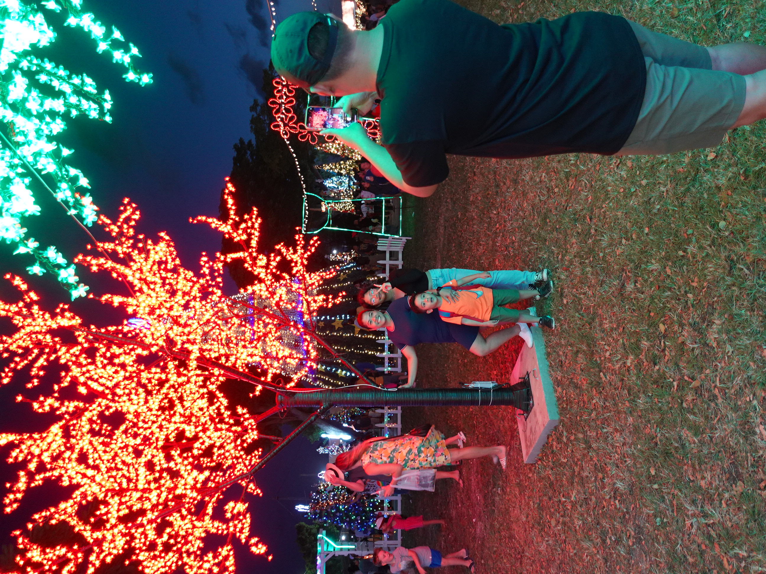 Saipan  residents take photos on Dec. 3, 2022,  at the Marianas Visitors Authority’s illumination display at Garapan Fishing Base, Saipan.  In celebration of Lunar New Year on Jan. 22, 2023, the light sculptures will remain on display throughout the month.