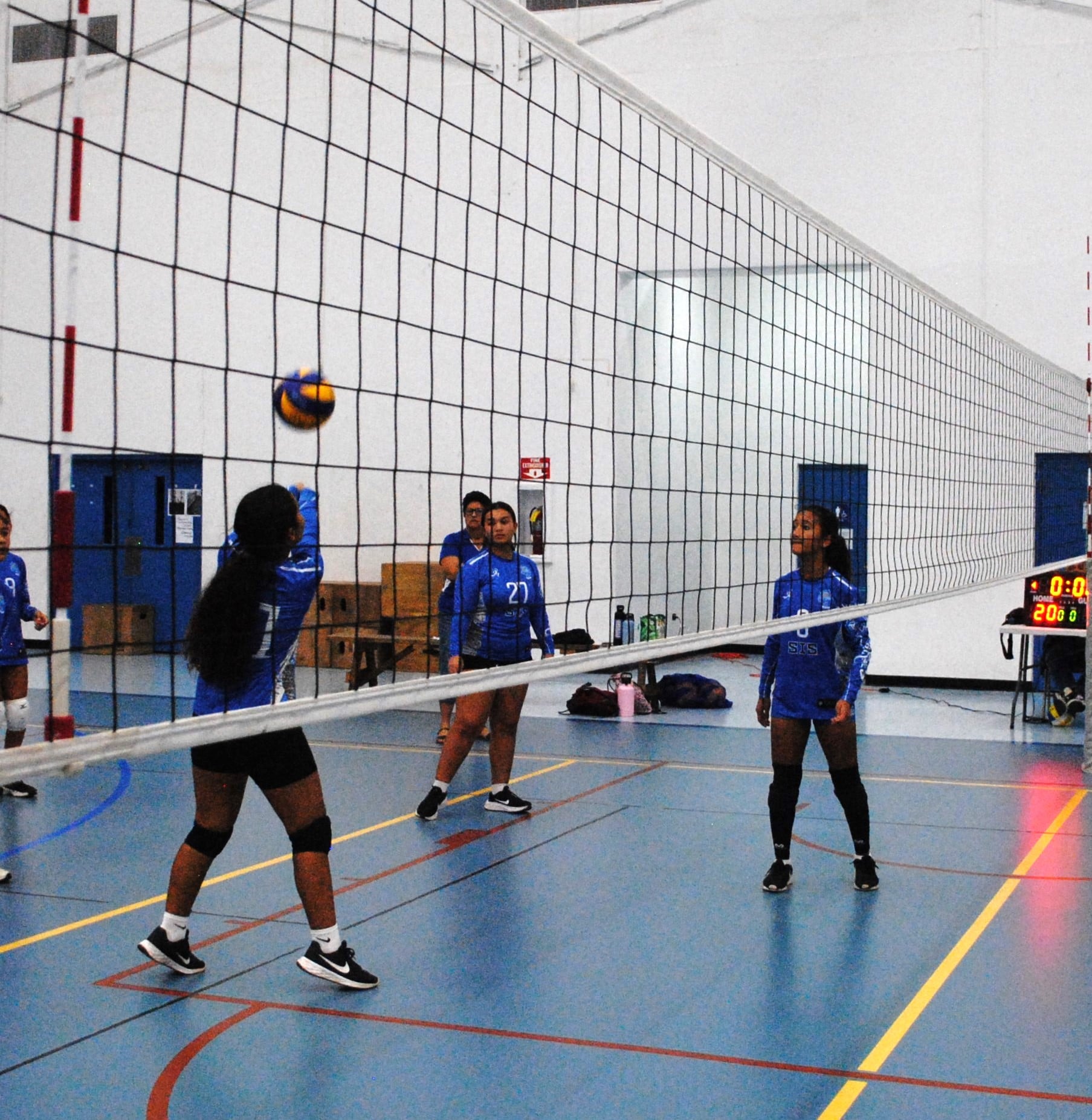 Saipan International School's varsity team attempts a bump return during a girls middle school division game of the NMIVA-PSS Interscholastic Volleyball League at the MHS gym.