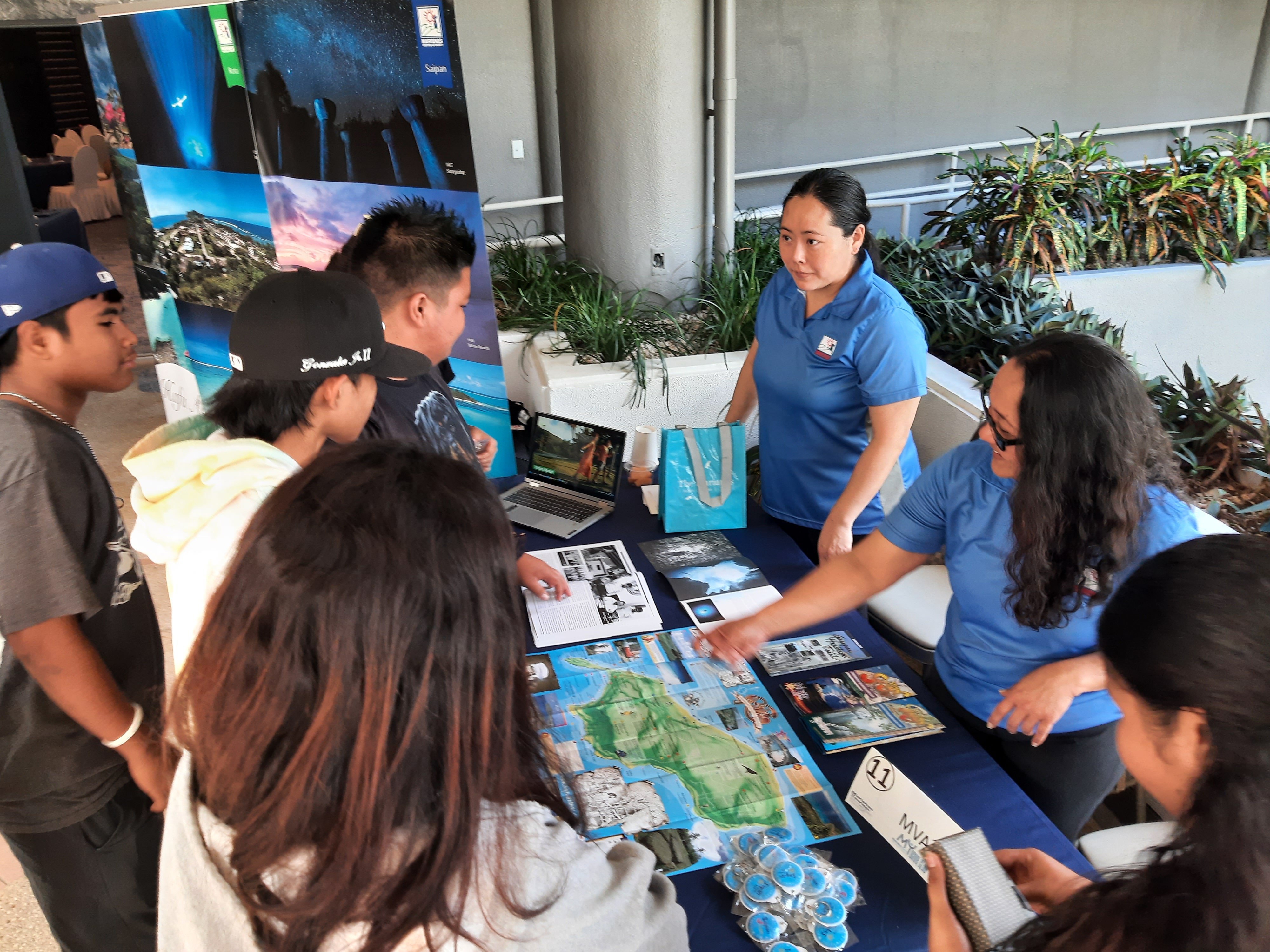 Marianas Visitors Authority Marketing Specialists Skye Seo and Brenda Repeki, third and second right, share about the office’s work at the 2023 Marianas Tourism Education Council Tourism Summit with school MY WAVE — Marianas Youth Welcome All Visitors Enthusiastically — Clubs on Jan. 19, 2023, at Kensington Hotel Saipan.