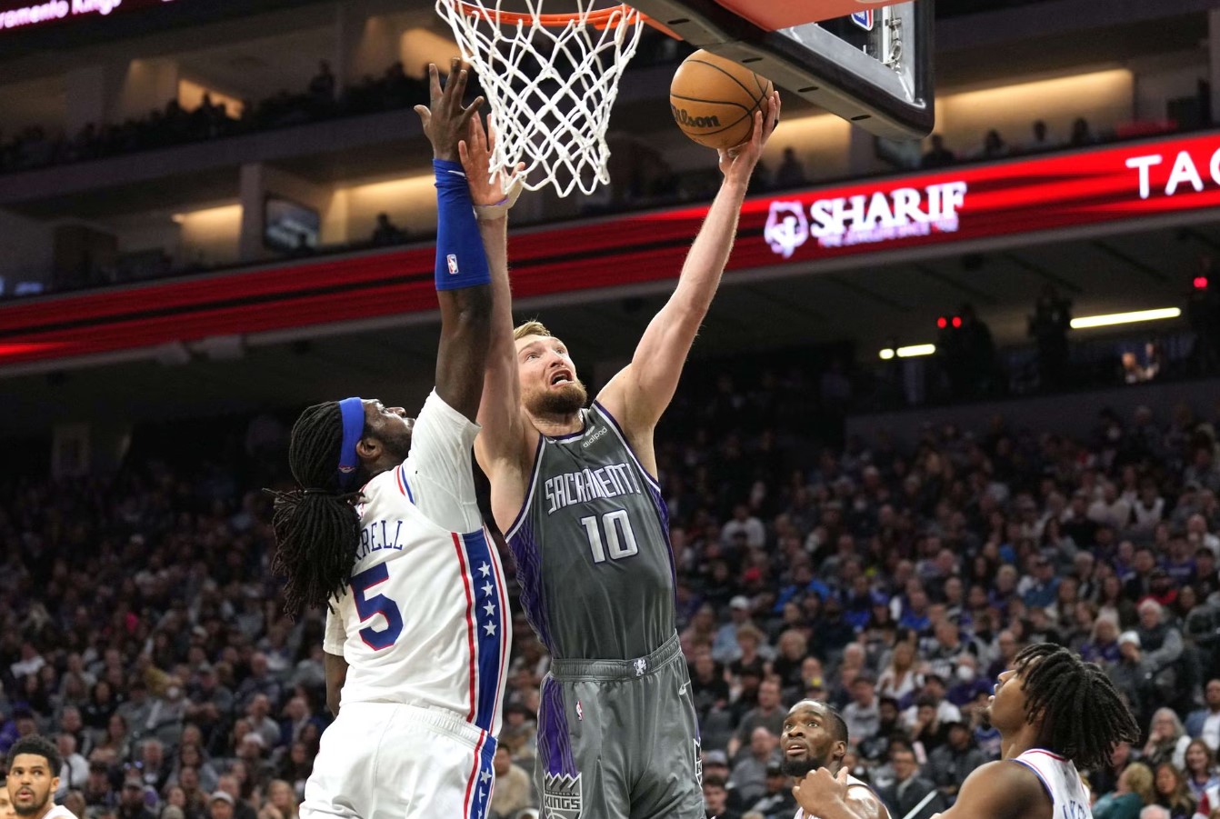 Sacramento Kings forward Domantas Sabonis (10) shoots against Philadelphia 76ers center Montrezl Harrell (5) during the fourth quarter at Golden 1 Center in Sacramento, California on Jan. 21, 2023.