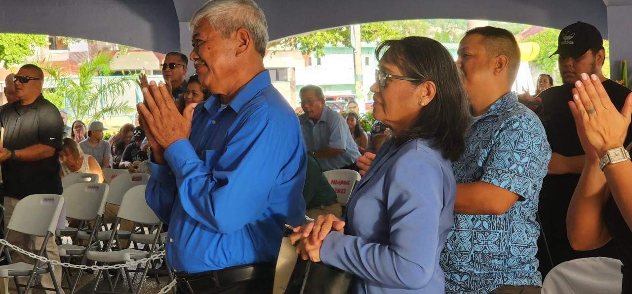George and Lucy Hocog, the parents of Rota Mayor Aubry M. Hocog, applaud as their daughter takes the stage to give her inaugural address.
