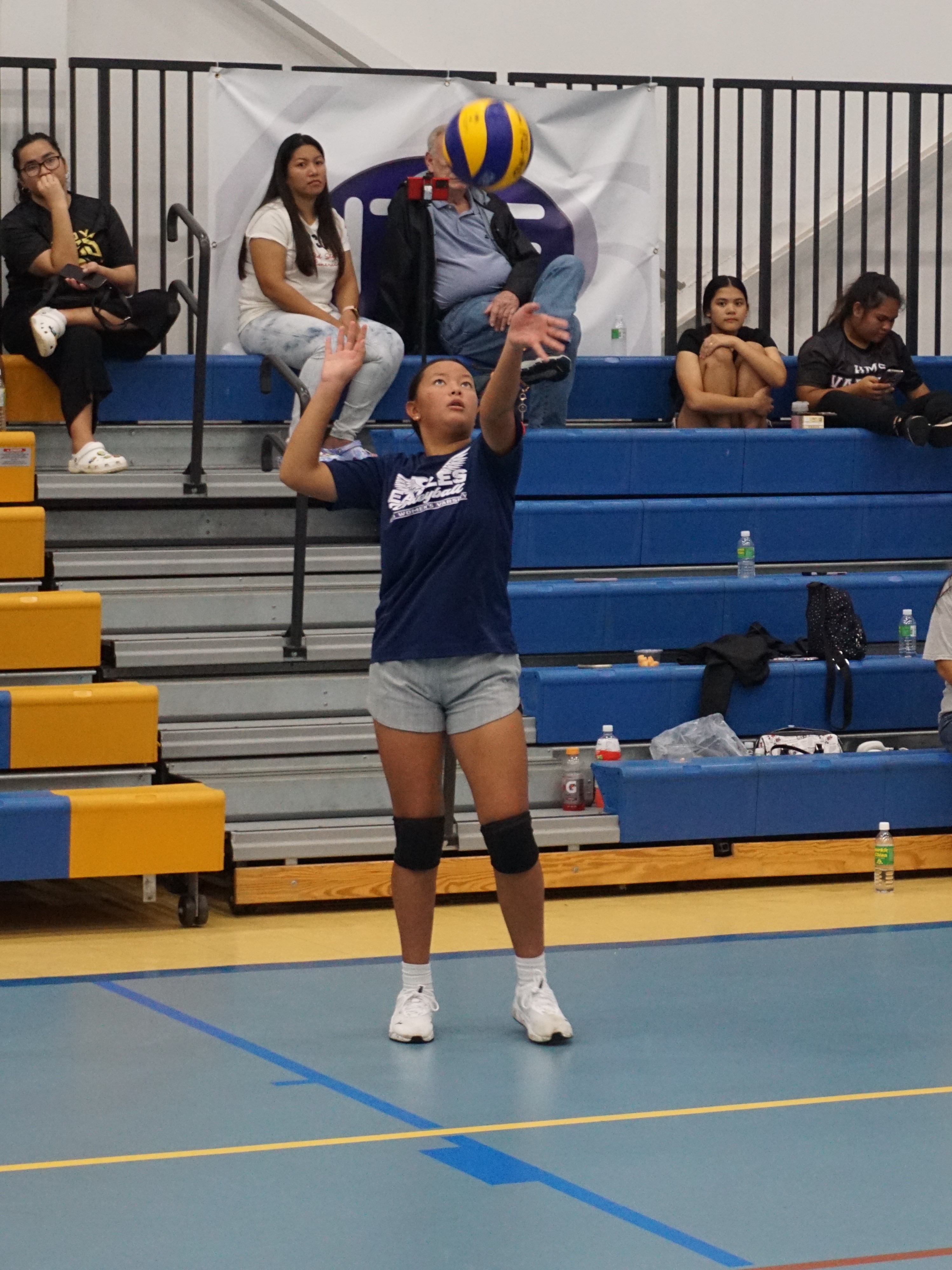 GCA's Nevaeh Camacho attempts an overhead serve.