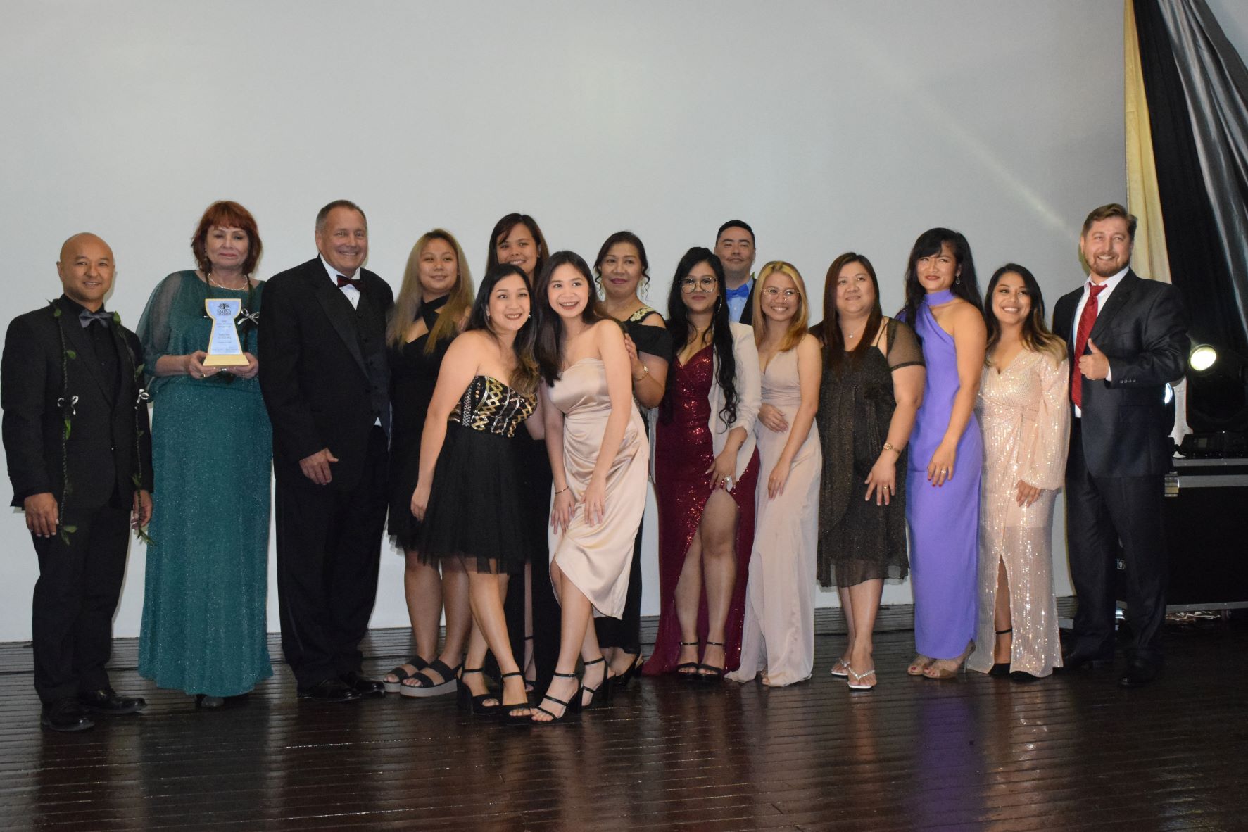 Paradise Dental Spa owners, Donna Krum, second left, and Dr. Nelson Krum, third left, with their staffers and Saipan Chamber of Commerce President Joe Guerrero, left.