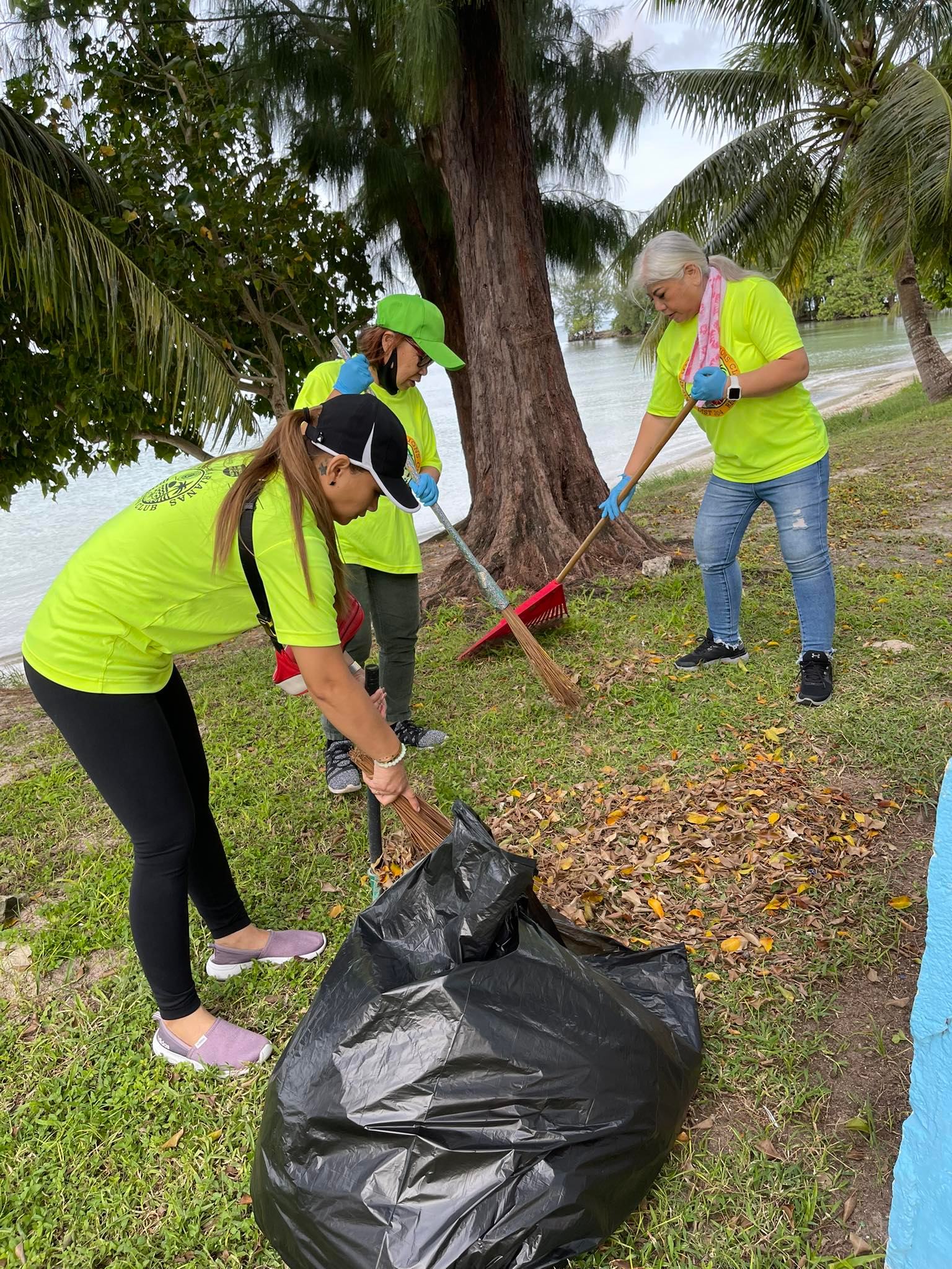 Saipan Marianas Lions Club members Arrianne Baculod, Dyna Cabrera and Alicia Loren clean up a beach area across from the JP Center in Garapan on Sunday, Jan. 22.