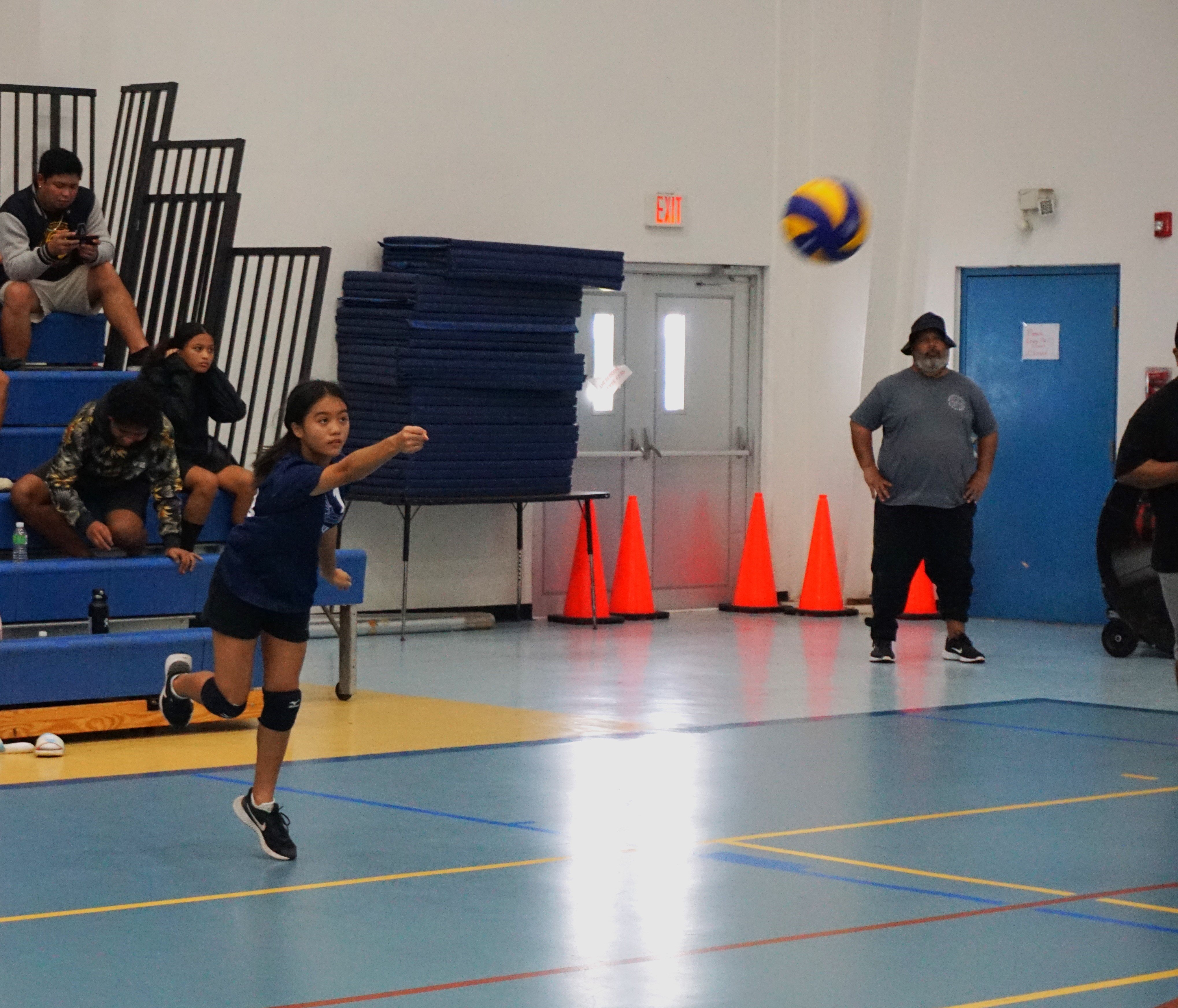 Grace Christian Academy’s Sofia Gomez connects the underhand serve during the girls middle school division championship of the NMIVA-PSS Interscholastic Volleyball League on Saturday at the MHS gym.