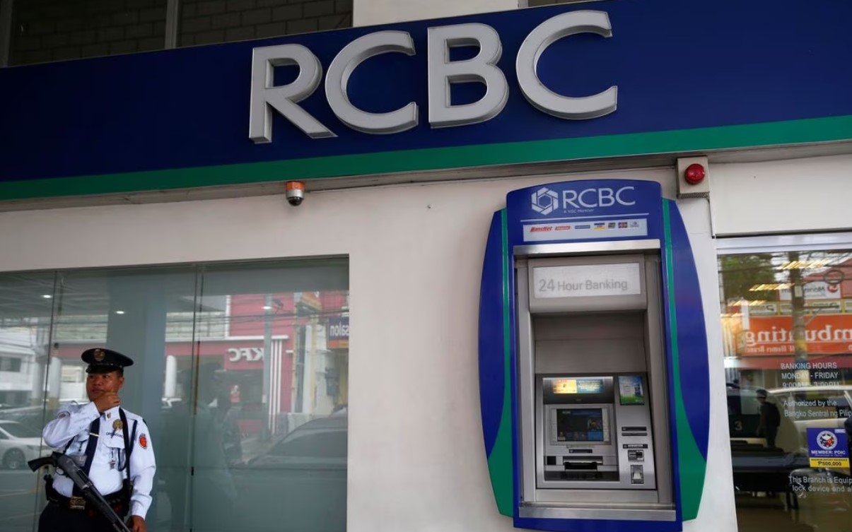 A security guard stands guard outside a branch of Rizal Commercial Banking Corporation in Parañaque City, Metro Manila, the Philippines on August 2, 2016.