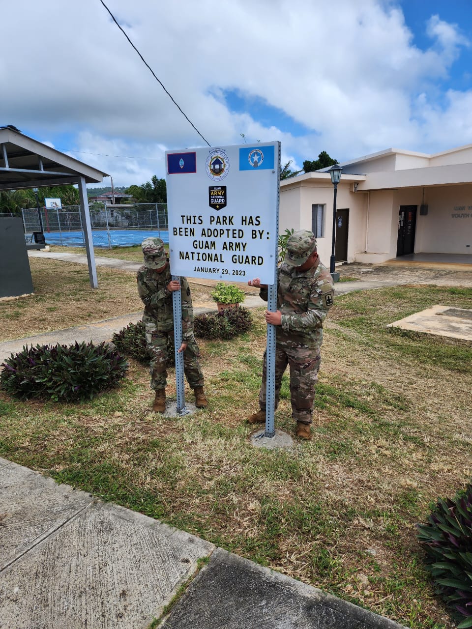 U.S. Army National Guard members install a sign at San Vicente Central Park which they “adopted” on Sunday.