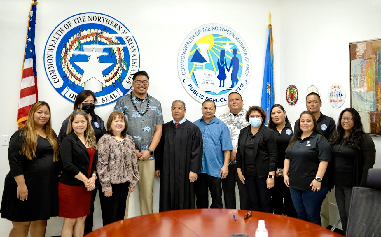 Board of Education Vice Chairman Antonio L. Borja poses for a photo with Head Start/Early Head Start Director Lathania Angui, PSS Finance and Budget Director Arlene Lizama, Federal Programs Officer Jacqueline Che, Senior Director for Accountability Research and Evaluation Dr. Rizalina Liwag, Commissioner of Education Dr. Alfred B. Ada, Associate Commissioner for Administrative Services Eric Magofna, Senior Director for Curriculum and Instruction Jackie Quitugua, Communications and Media Coordinator Randee Jo Barcinas-Manglona, Human Resources Director Lucretia Deleon Guerrero, State Infrastructure Technology Director Jesse Tenorio, Instructional Technology and Distance Education interim Director Lorraine Catienza and Supreme Court Justice Perry Inos.
