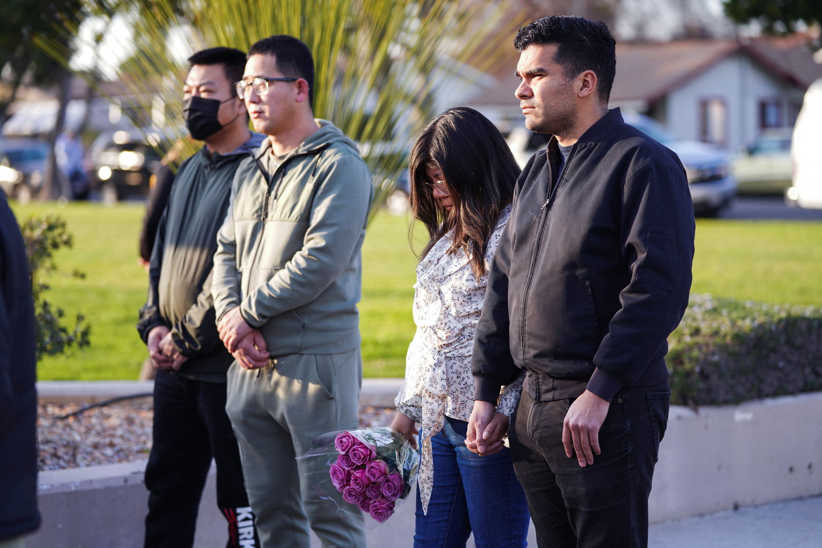 Members of the community hold a prayer vigil near the scene of a shooting that took place during a Chinese Lunar New Year celebration, in Monterey Park, California, Jan. 22, 2023.