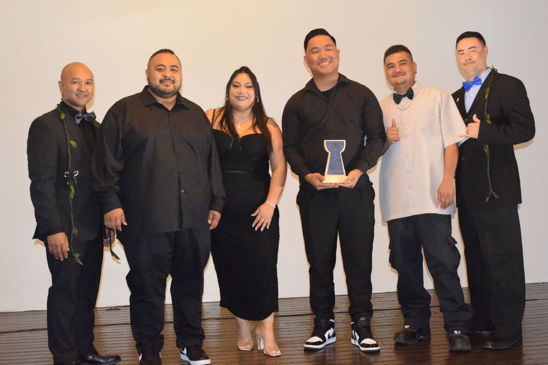 Bistro Boyz entrepreneur Vincent "Ben" Babauta Jr., second left, and staffers with Saipan Chamber of Commerce President Joe Guerrero, left.