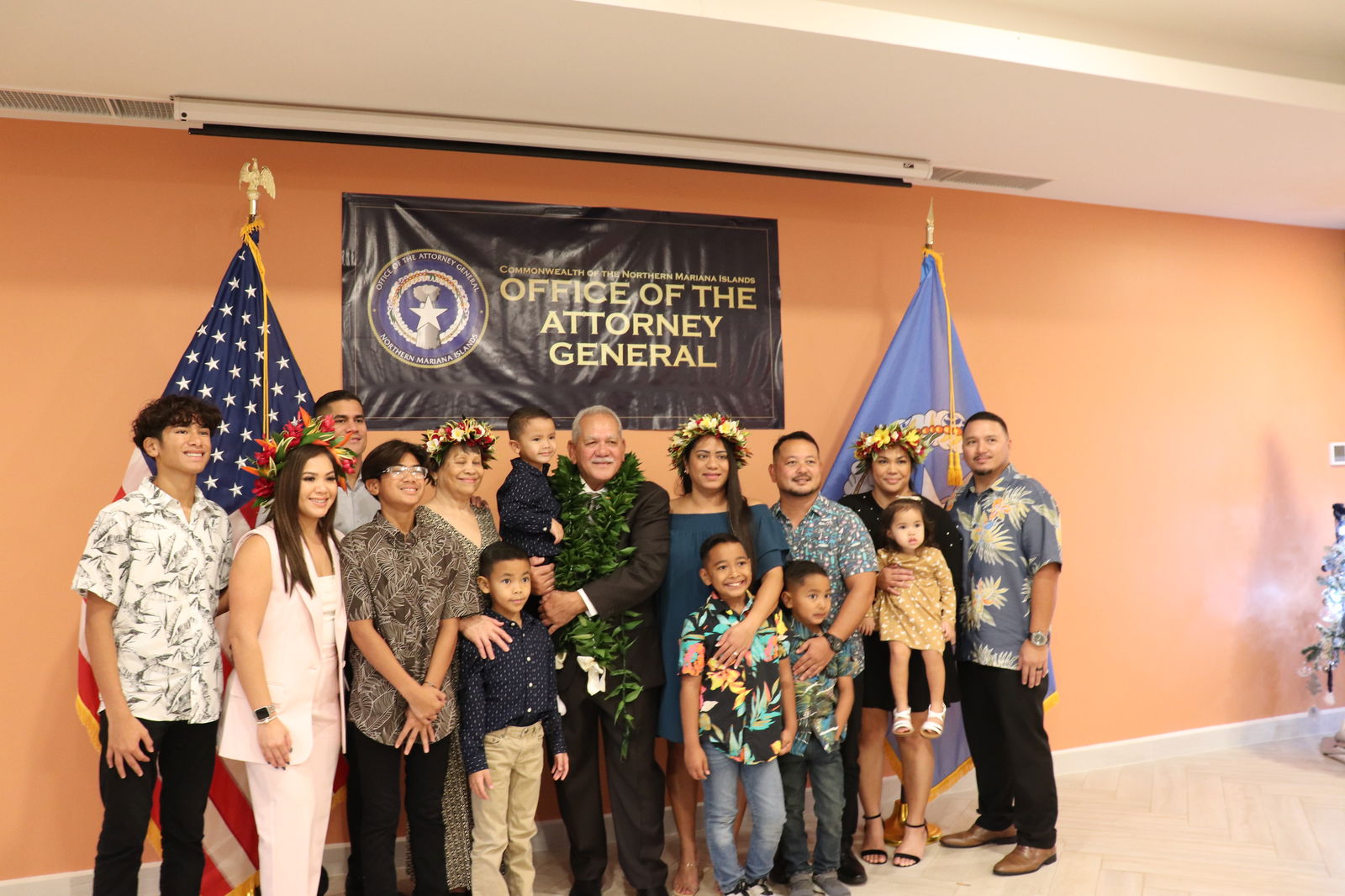 Attorney General Edward Manibusan poses for a photo with his family after he was sworn in on Saturday at the Crowne Plaza Resort Saipan.