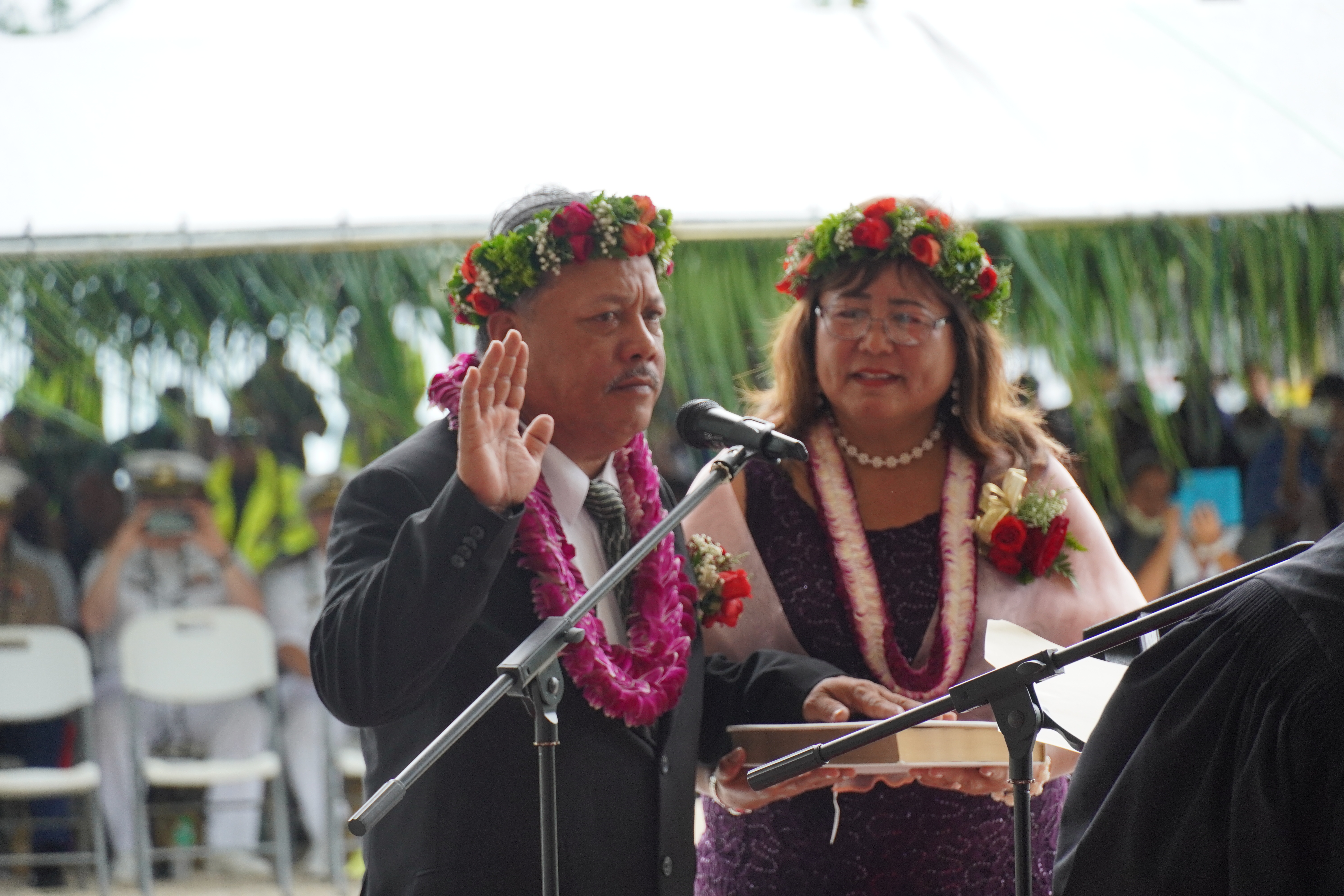 Tinian and Aguiguan Mayor Edwin P. Aldan is sworn into office as his wife Rosita holds a Bible.