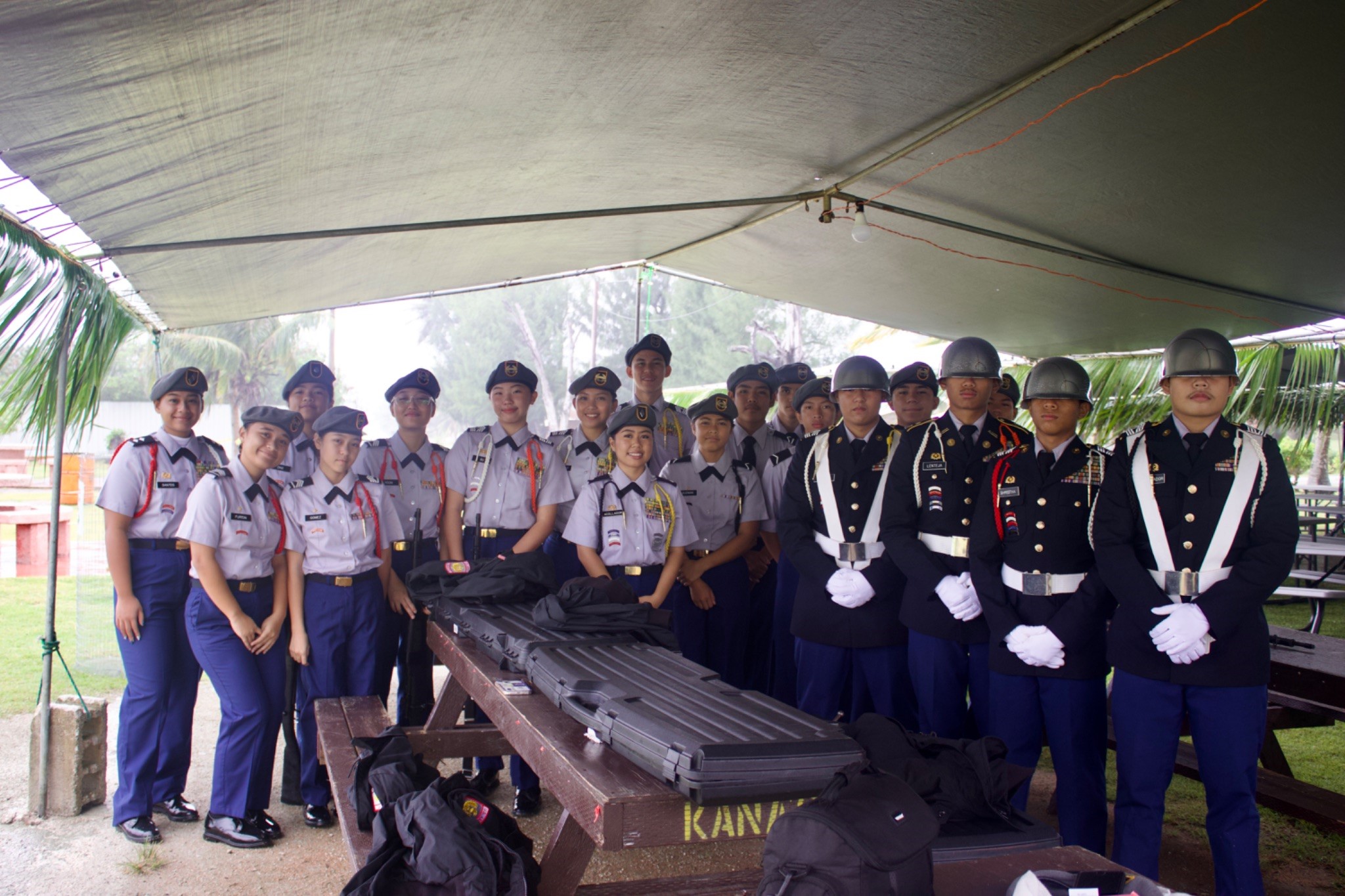 The Tinian JROTC Stallion Battalion Color Guard and Honor Guard pose for a group photo.