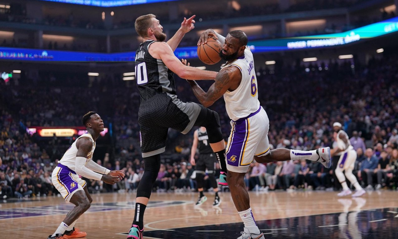Los Angeles Lakers forward LeBron James (6) holds onto a rebound next to Sacramento Kings forward Domantas Sabonis (10) in the first quarter at the Golden 1 Center in Sacramento, California, Jan. 7, 2023.