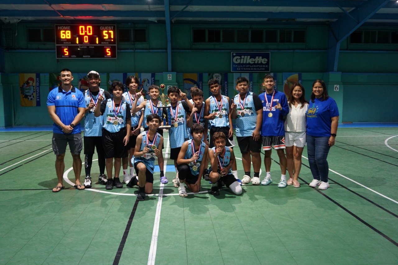 The Kagman players pose with the U13 boys championship trophy during the awards ceremony of the 2022 Marianas Village Pride Basketball League at the TSL Sports Complex.