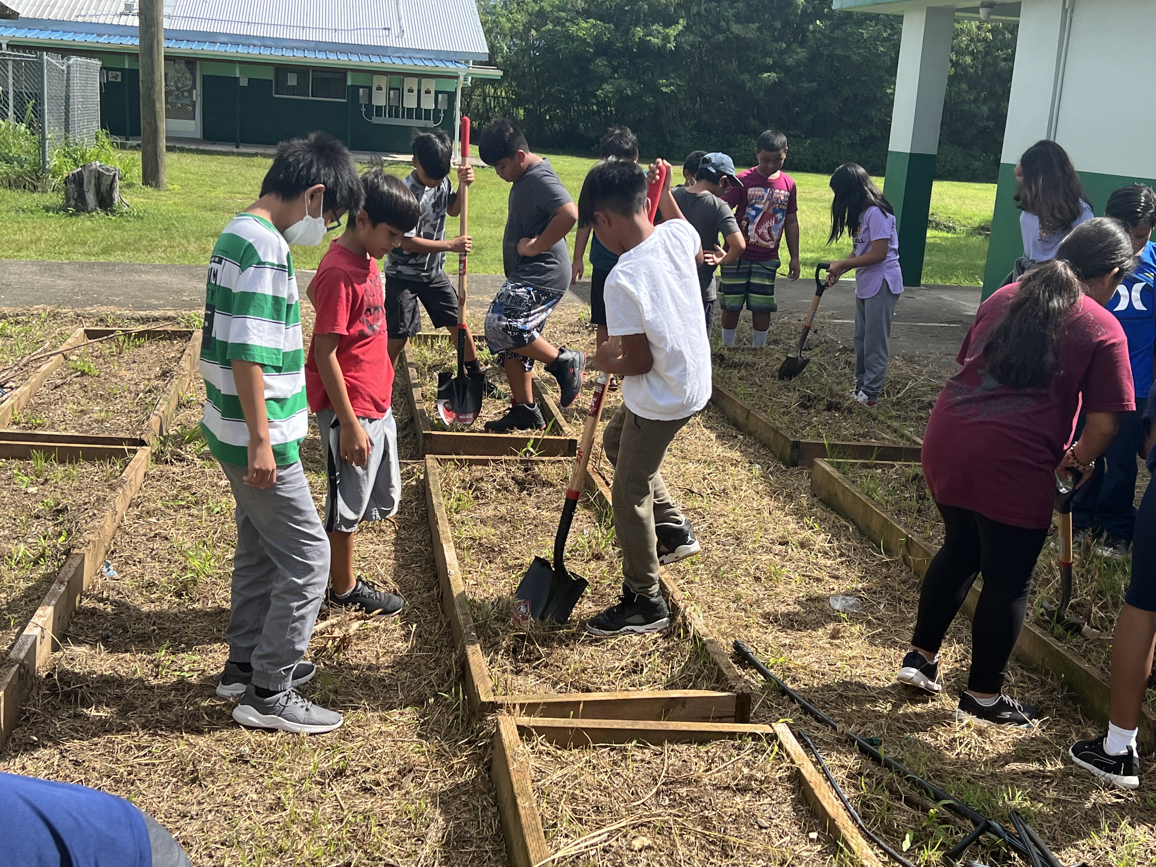 Koblerville Elementary School students complete their first Marianas School Pride Campus Beautification Project on Dec. 22, 2022. The project aims to encourage students to be self-sufficient and enjoy being out in nature doing hands-on activities.