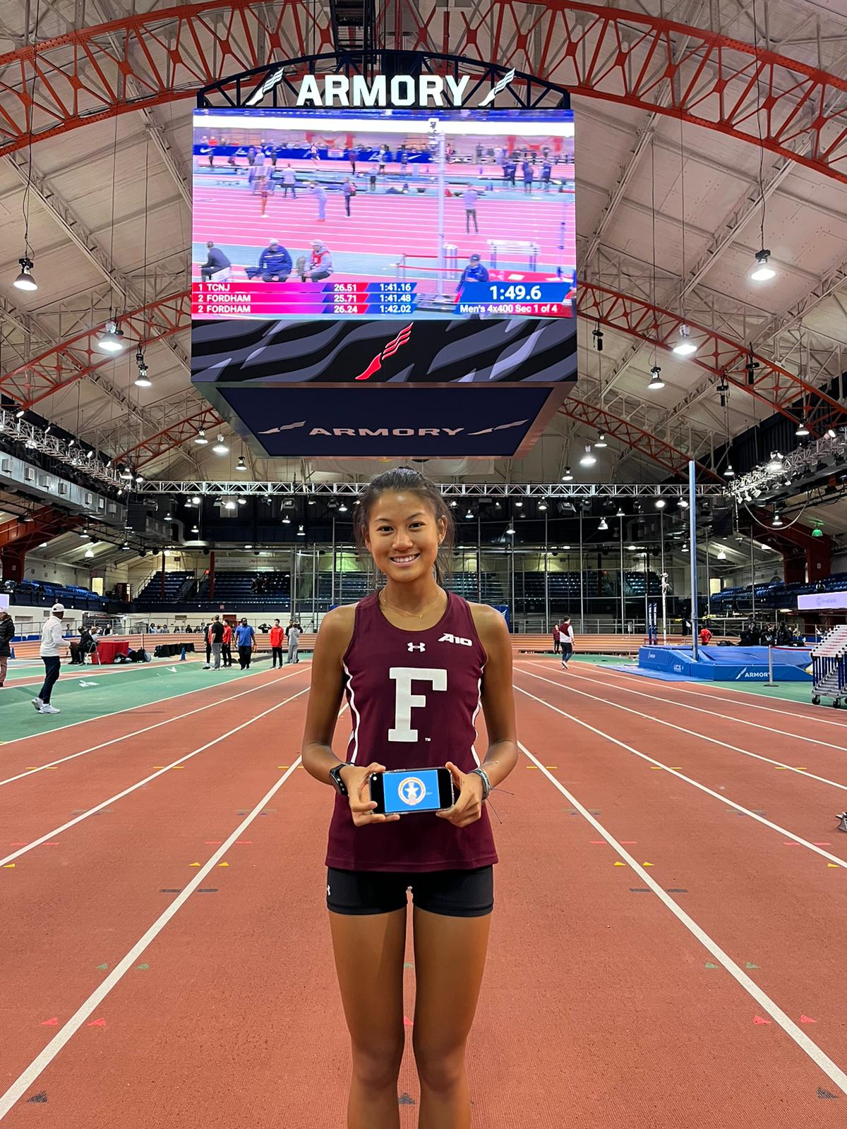 Tania Tan poses for a photo at the Armory Track in New York after breaking her old NMI record and setting a  new personal best in the 3000m event of the TCNJ Indoor Invitational on Jan. 14, 2023.
