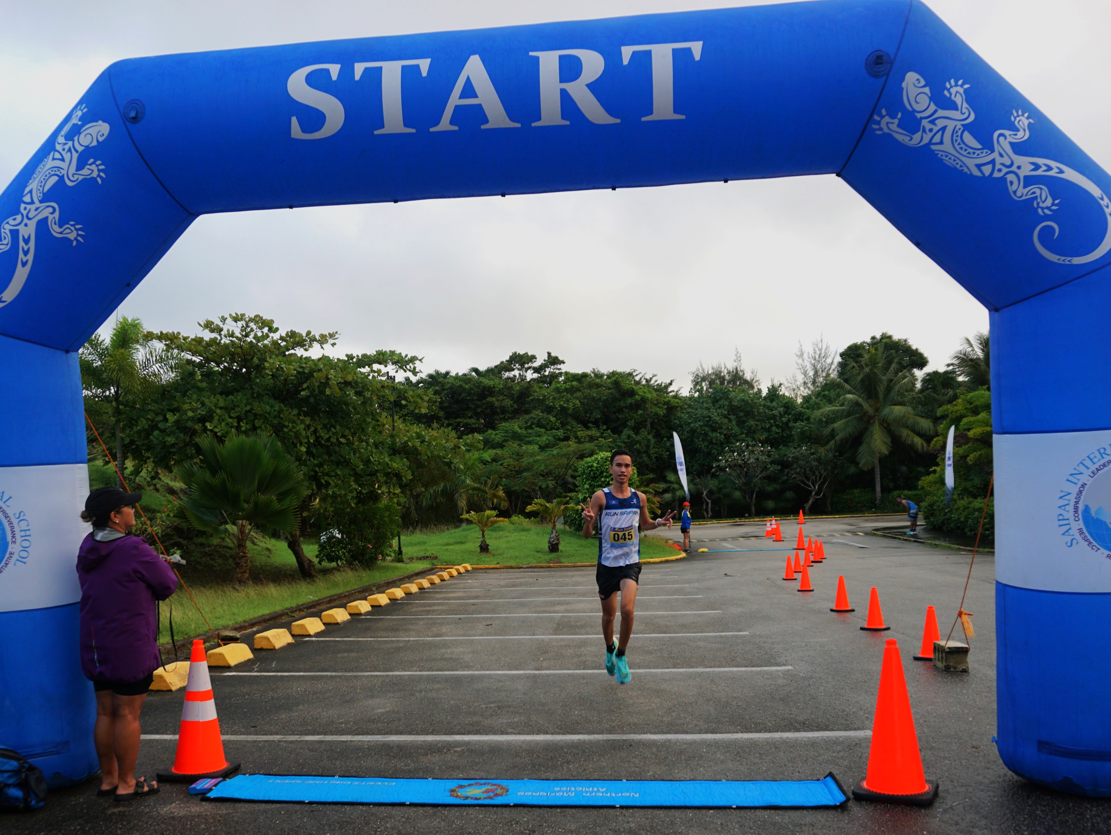 Sildrey Veloria takes first place in the men's division of the inaugural Run Saipan Trinity race, Day 1, in the Kensington Hotel upper parking lot on Saturday.