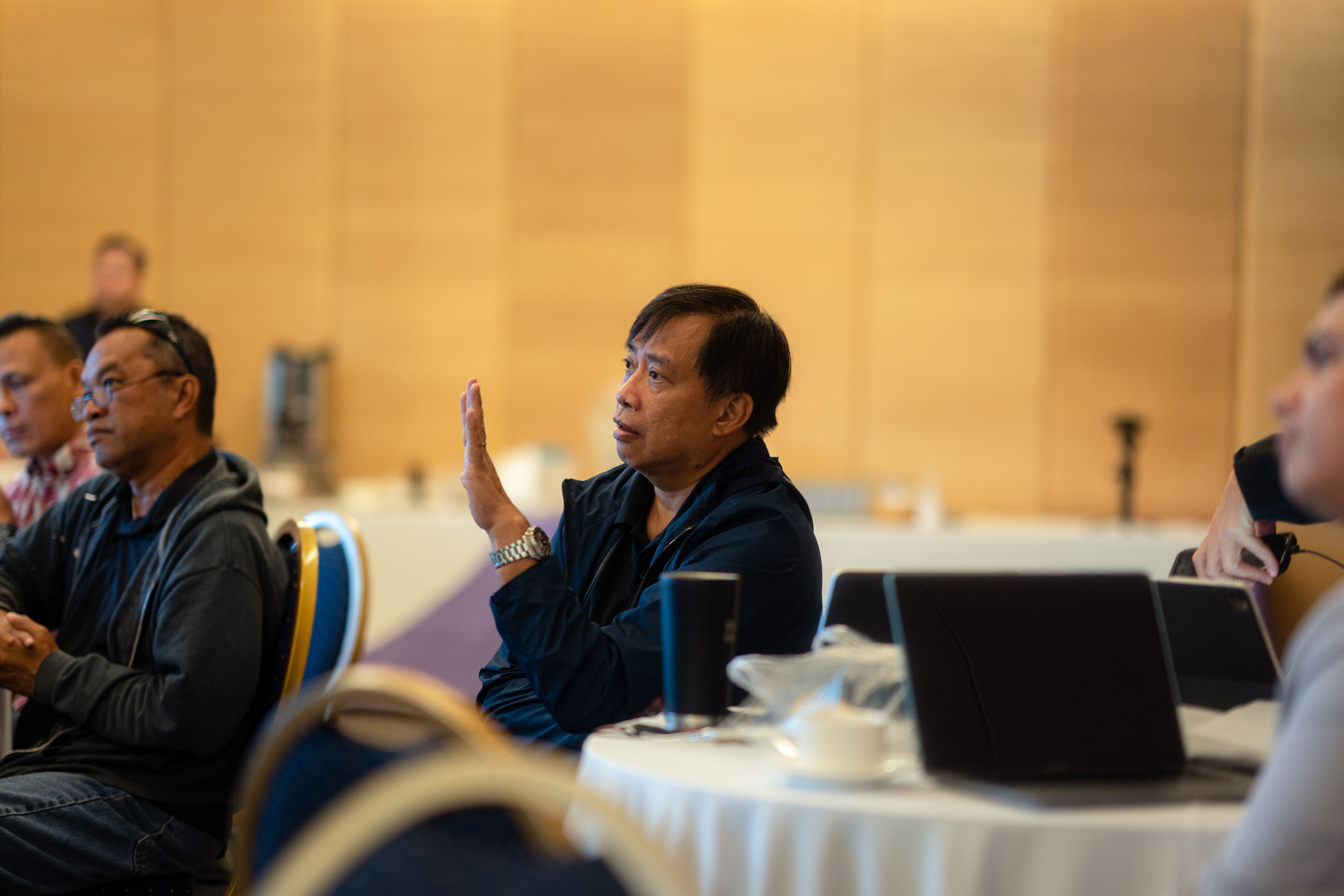 Mathematics Curriculum Program Coordinator Gus Loste speaks while Saipan Southern High School Principal Vince Dela Cruz and Chamorro Carolinian and Heritage Studies Program Director Jonas Barcinas listen.