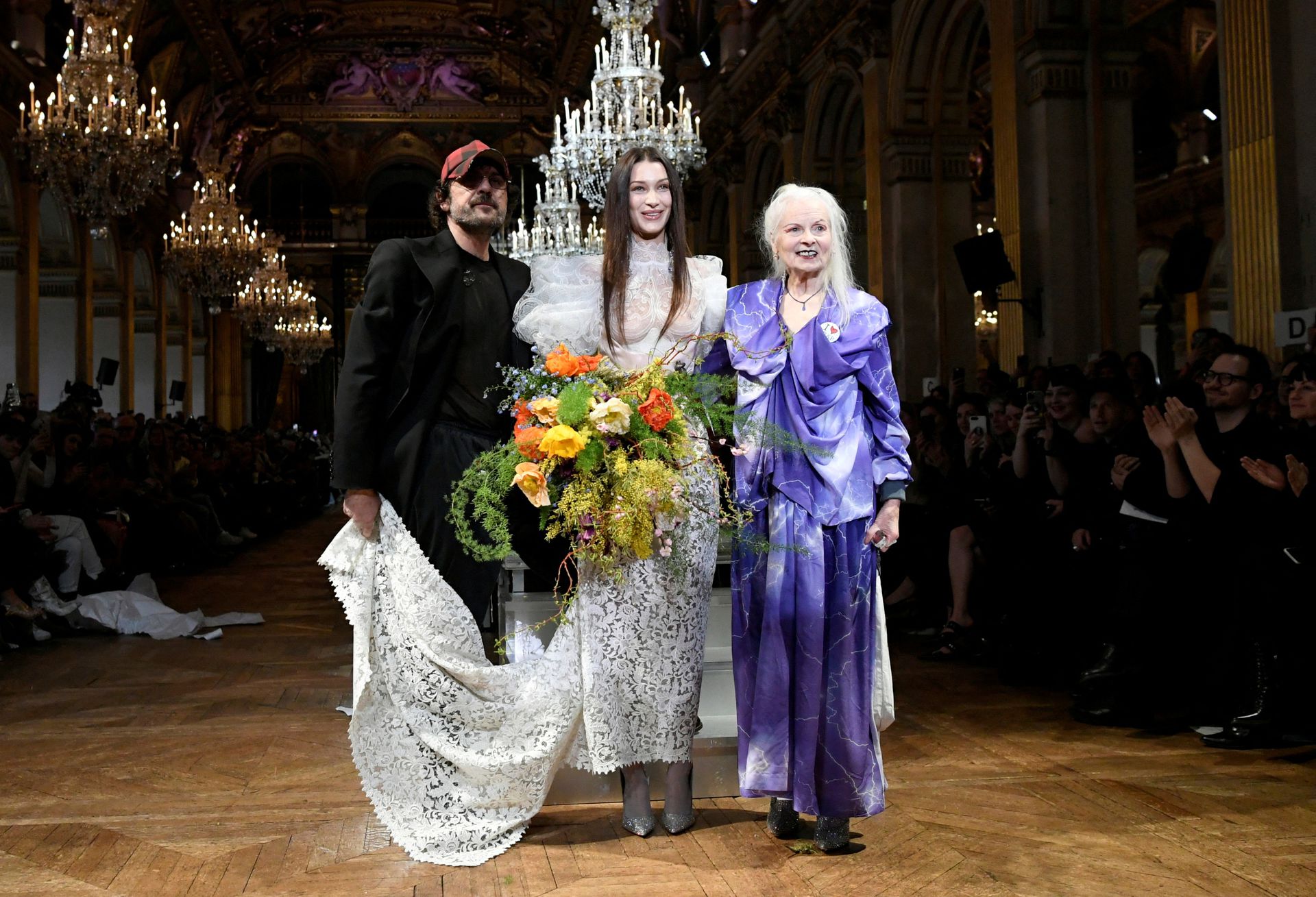 Designers Vivienne Westwood and Andreas Kronthaler pose with model Bella Hadid after their Fall/Winter 2020/21 women's ready-to-wear collection show during Paris Fashion Week in Paris, France on Feb. 29, 2020.