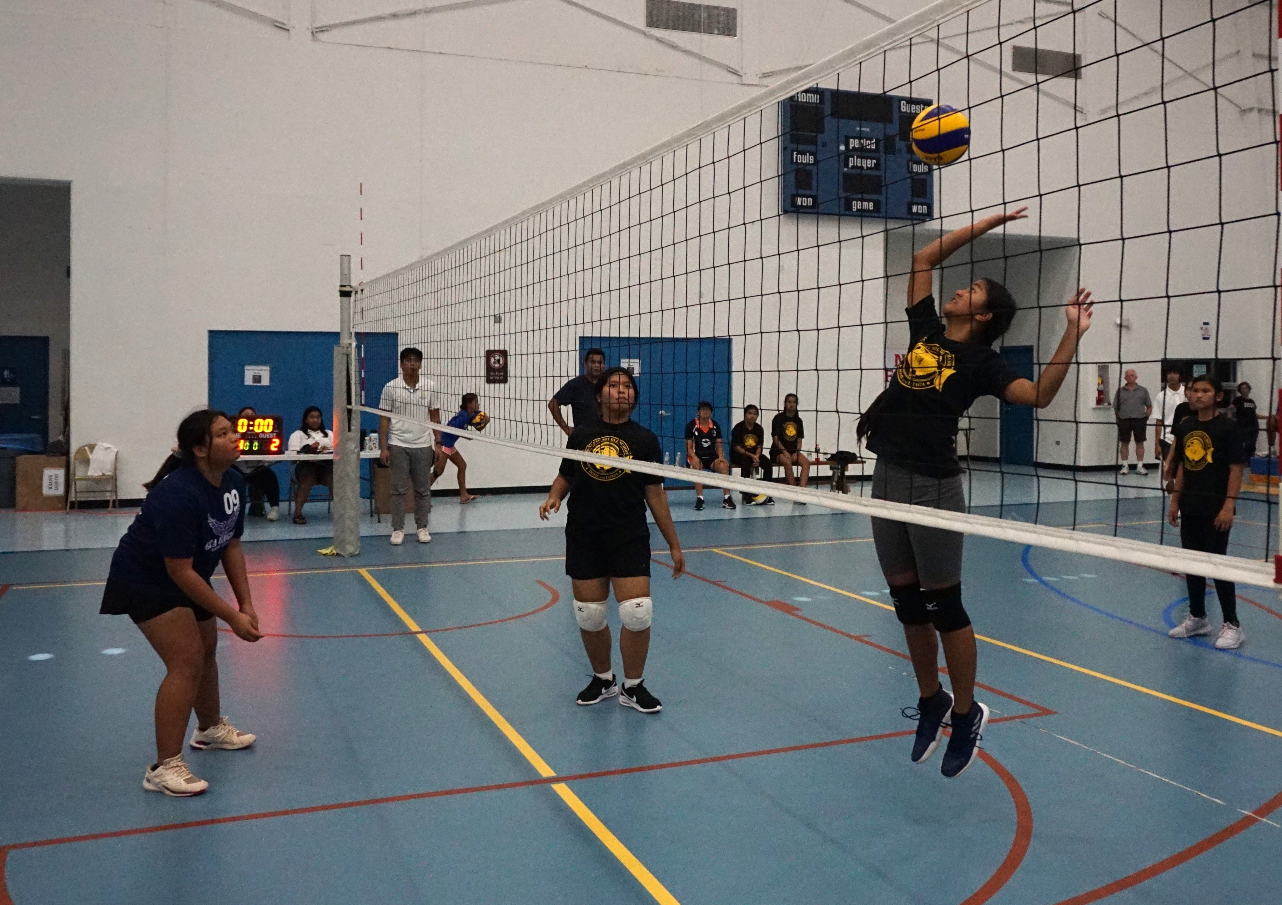 A Tanapag Middle School student attempts a spike return against Grace Christian Academy during the girls middle school division championship of the NMIVA-PSS Interscholastic Volleyball League on Saturday at the MHS gym.