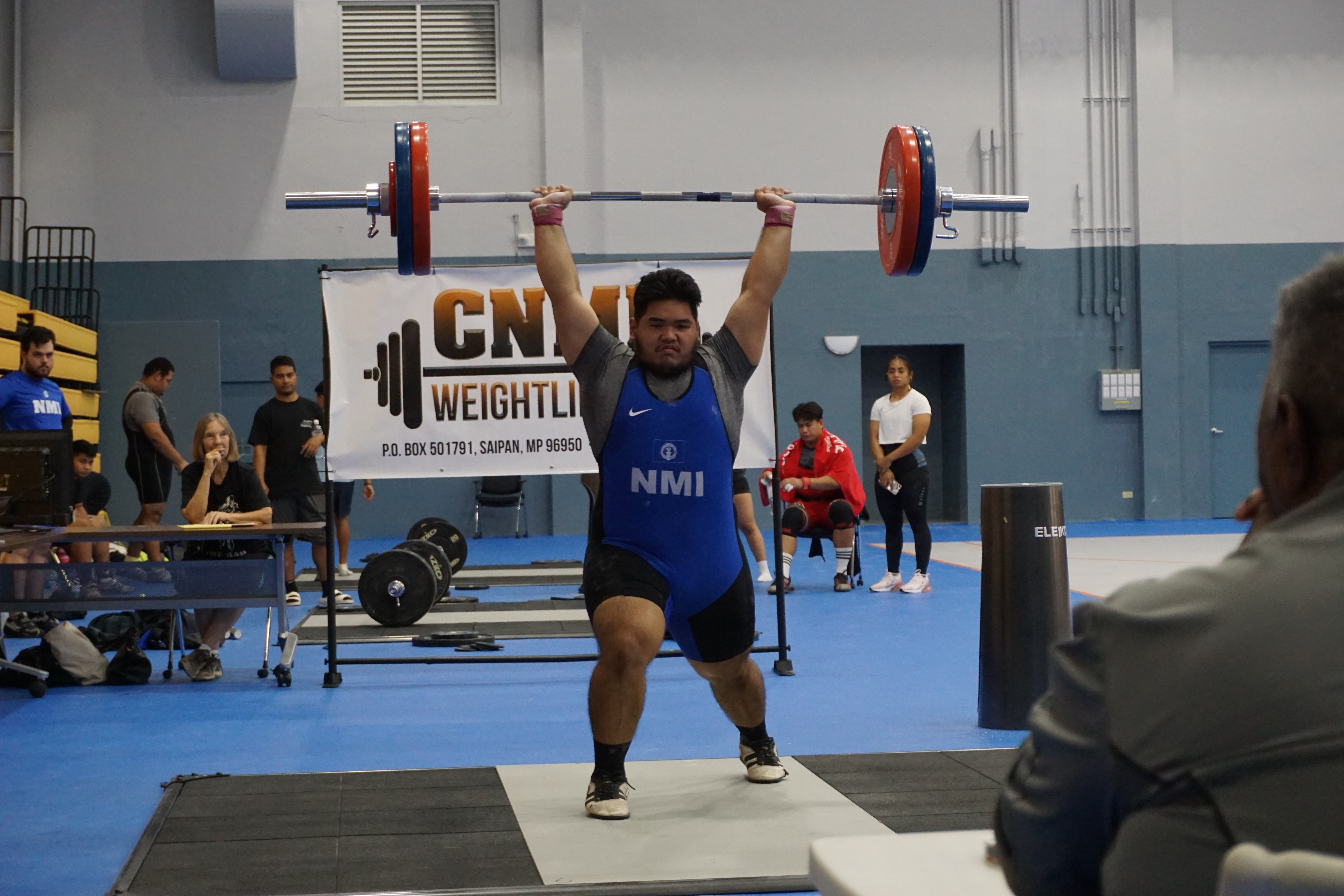 Joey Colisao extends for a successful 155kg clean & jerk lift during the CNMI Weightlifting qualifier at the Ada gym on Saturday.