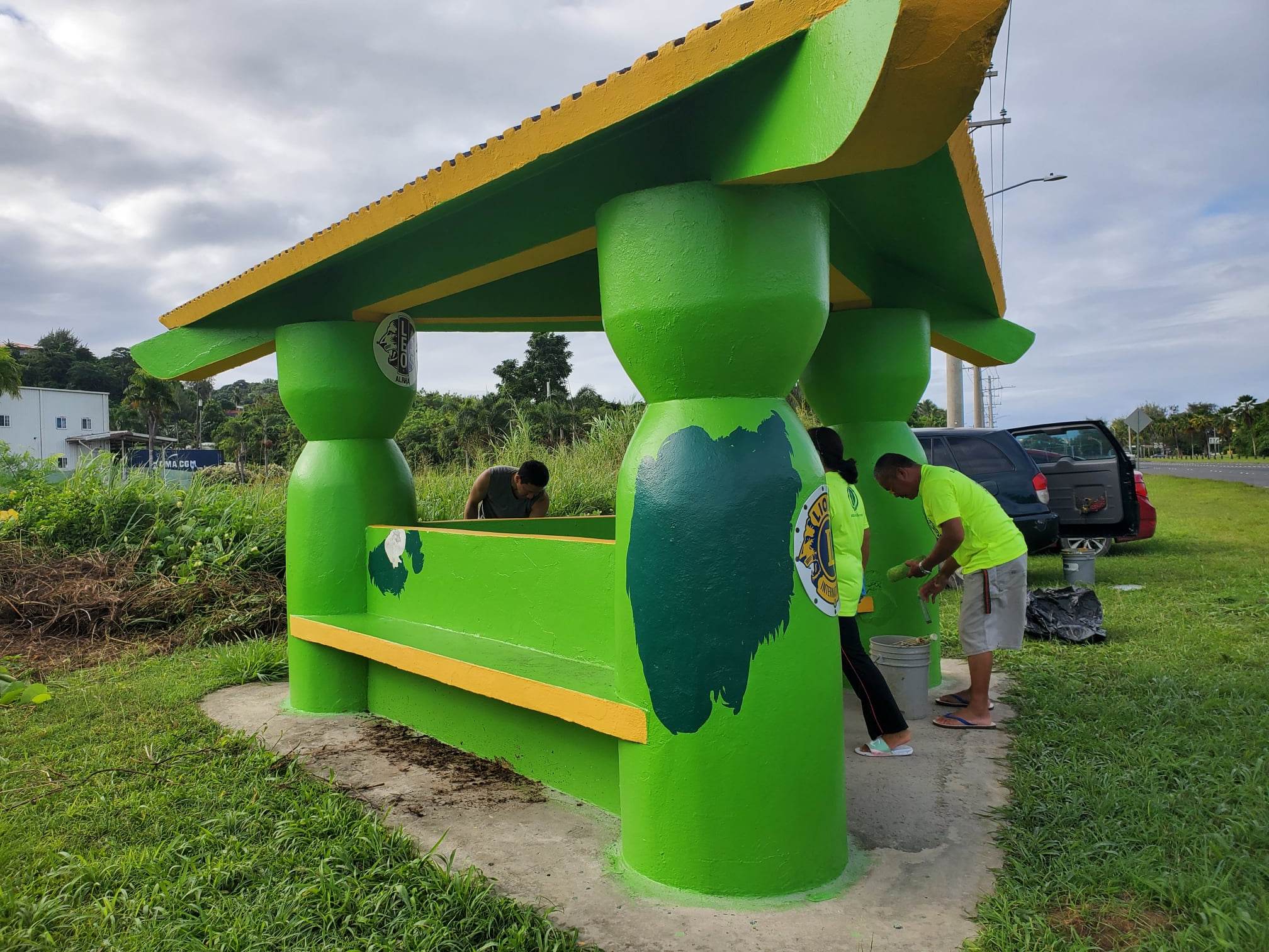 Members of the Saipan Marianas Lions Club pick up the trash at the lower Navy Hill bus shelter.