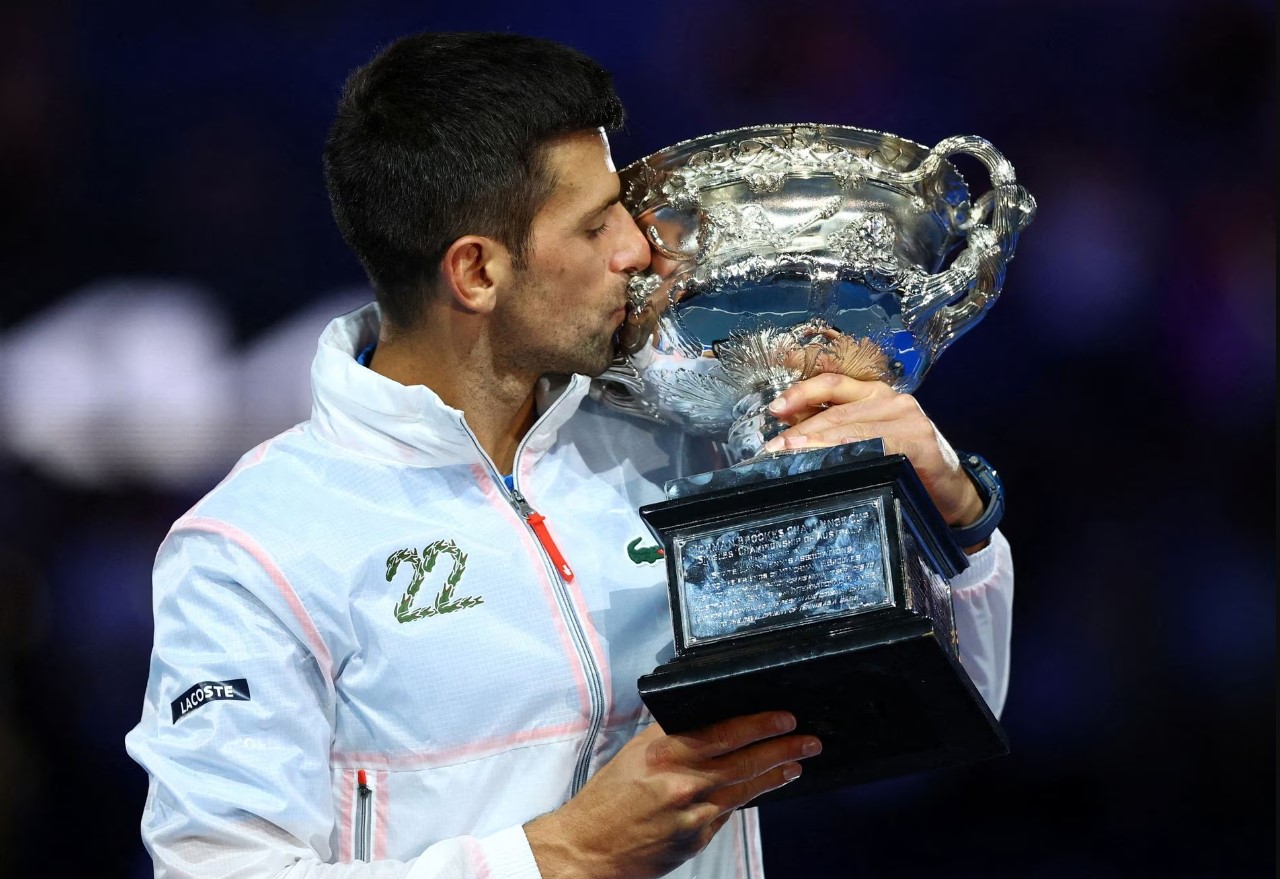 Serbia's Novak Djokovic celebrates with the trophy after winning his final match in the Australian Open against Greece's Stefanos Tsitsipas  at Melbourne Park, Melbourne, Australia on Jan. 29, 2023