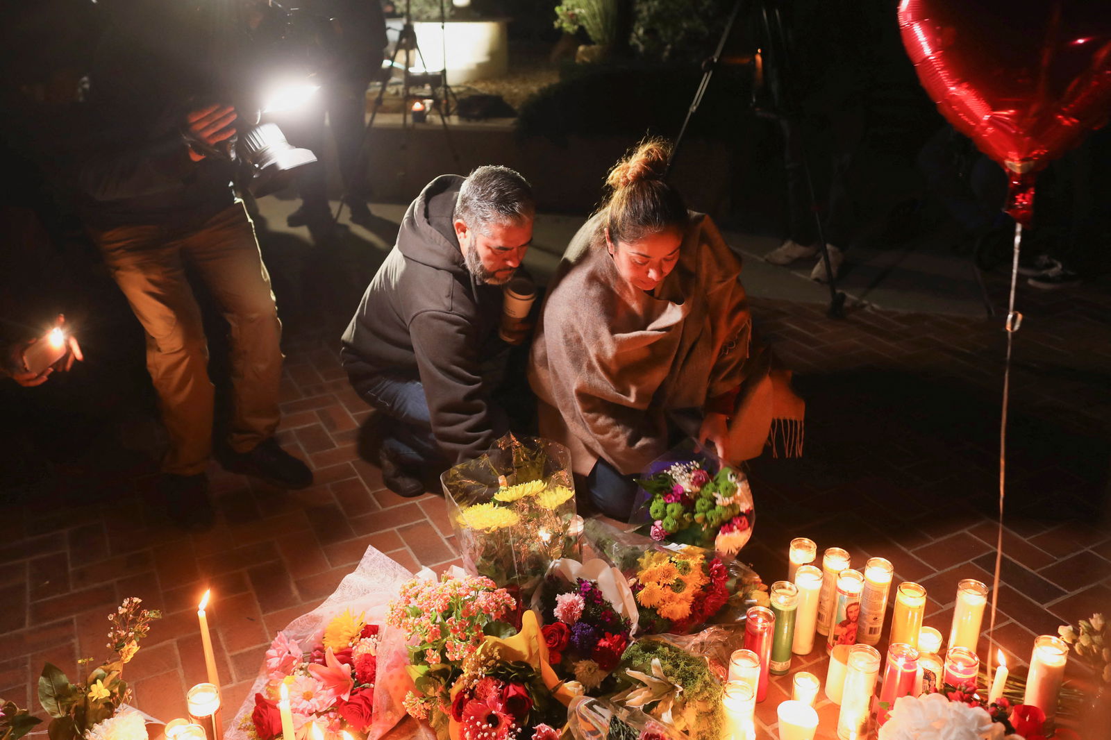 People gather for a candle light vigil after a mass shooting during Chinese Lunar New Year celebrations in Monterey Park, California, Jan. 23, 2023.
