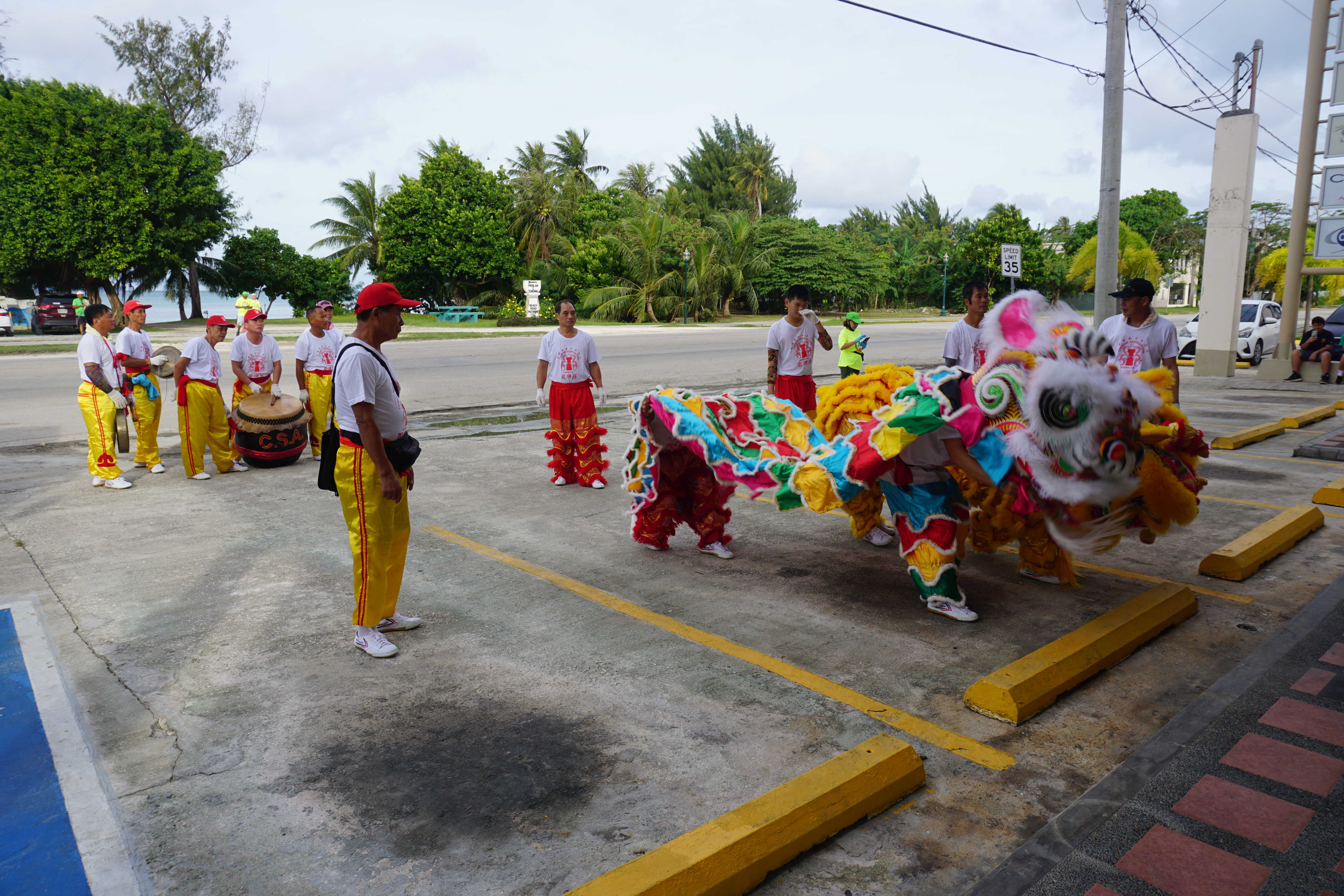 In celebration of the Lunar New Year, Chinese community members perform the traditional Lion Dance in the parking lot of the JP Center in Garapan on Sunday morning.