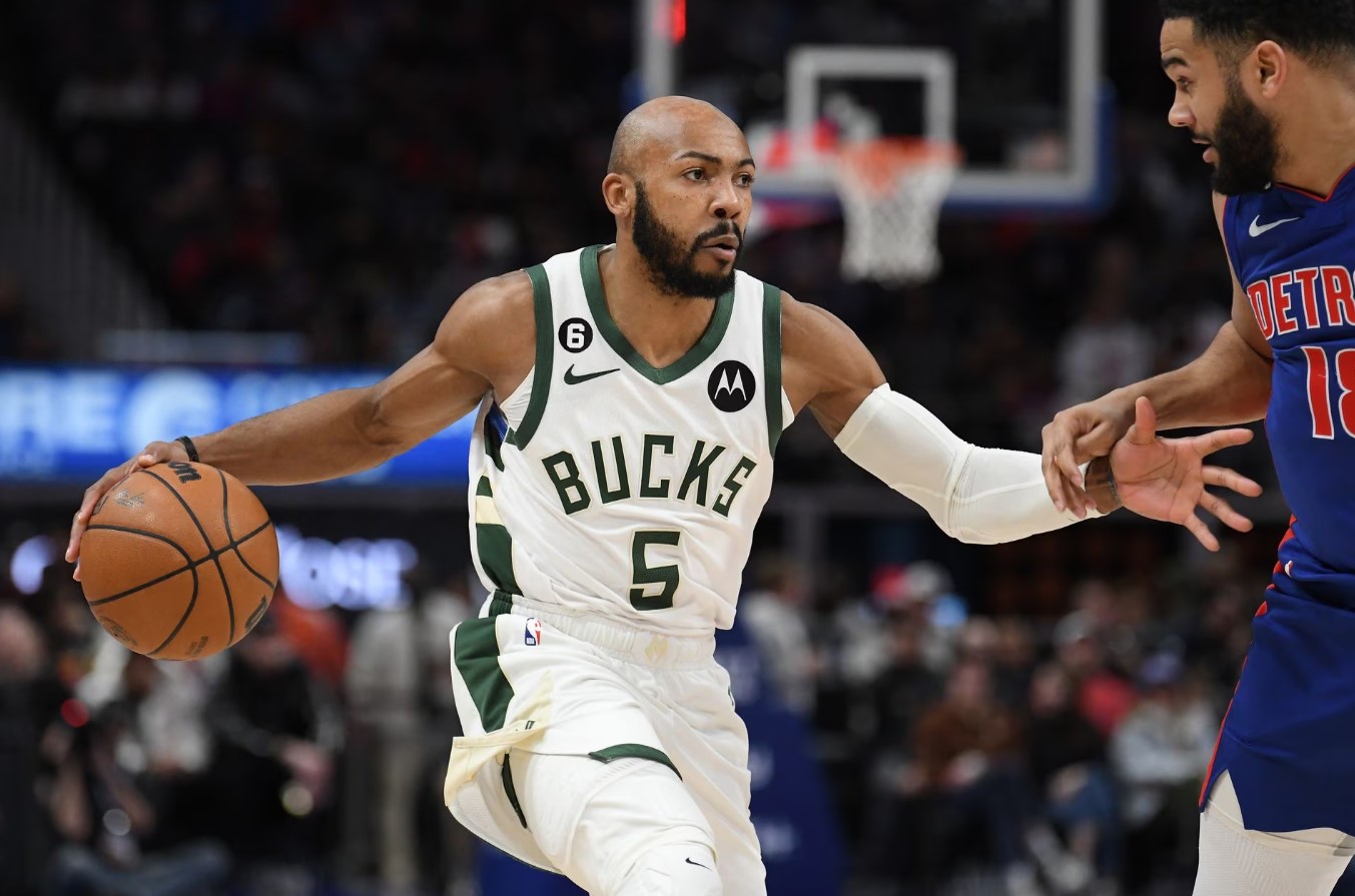 Milwaukee Bucks guard Jevon Carter (5) looks to drive past Detroit Pistons guard Cory Joseph (18) in the third quarter at Little Caesars Arena in Detroit, Michigan,  Jan. 23, 2023.