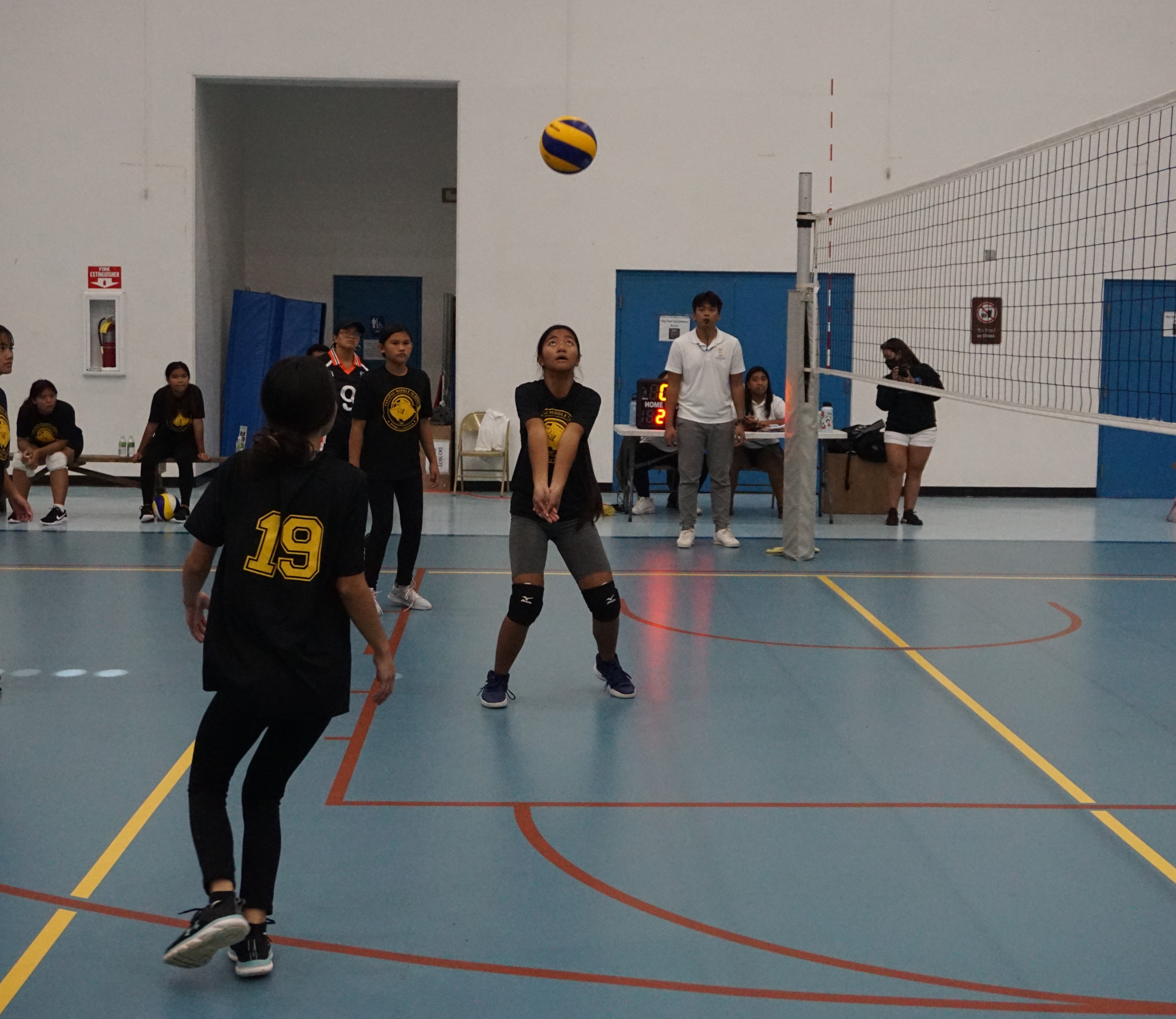 A TMS player extends for the bump to set up the play.