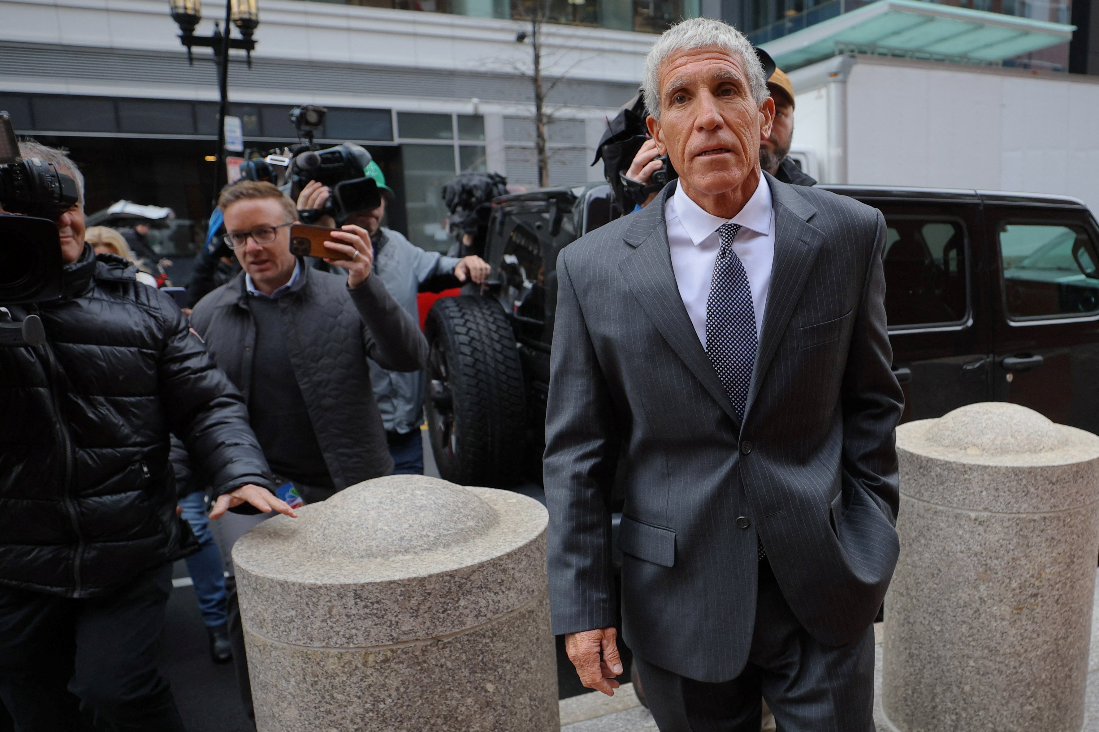 William "Rick" Singer, the California college admissions consultant who masterminded the vast fraud and bribery scheme at the center of the U.S. college admissions scandal known as "Varsity Blues," arrives for his sentencing hearing at the federal courthouse in Boston, Massachusetts, Jan. 4, 2023.