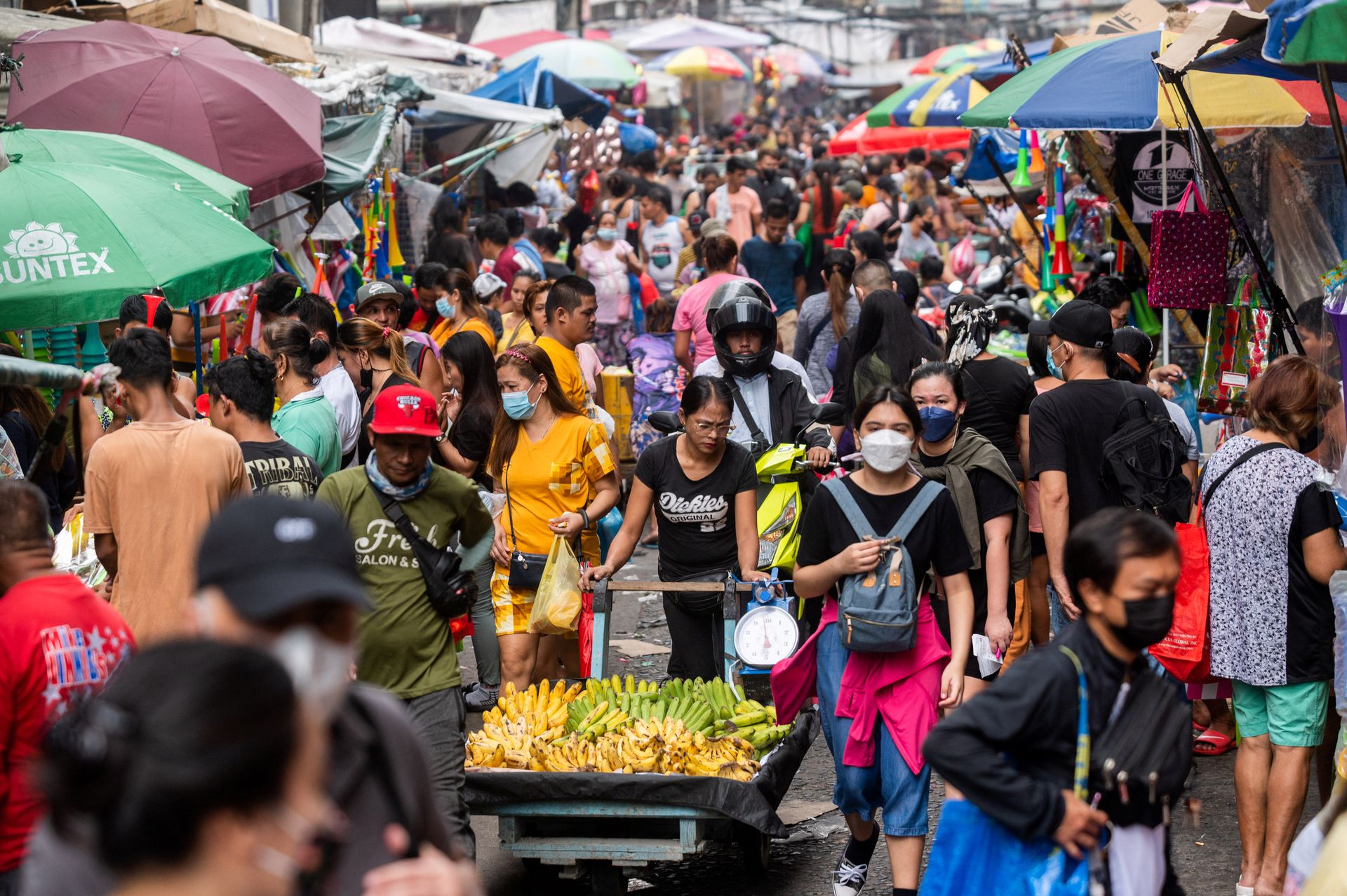 People flock to a public market ahead of the New Year celebration, in Manila, the Philippines, Dec. 30, 2022.
