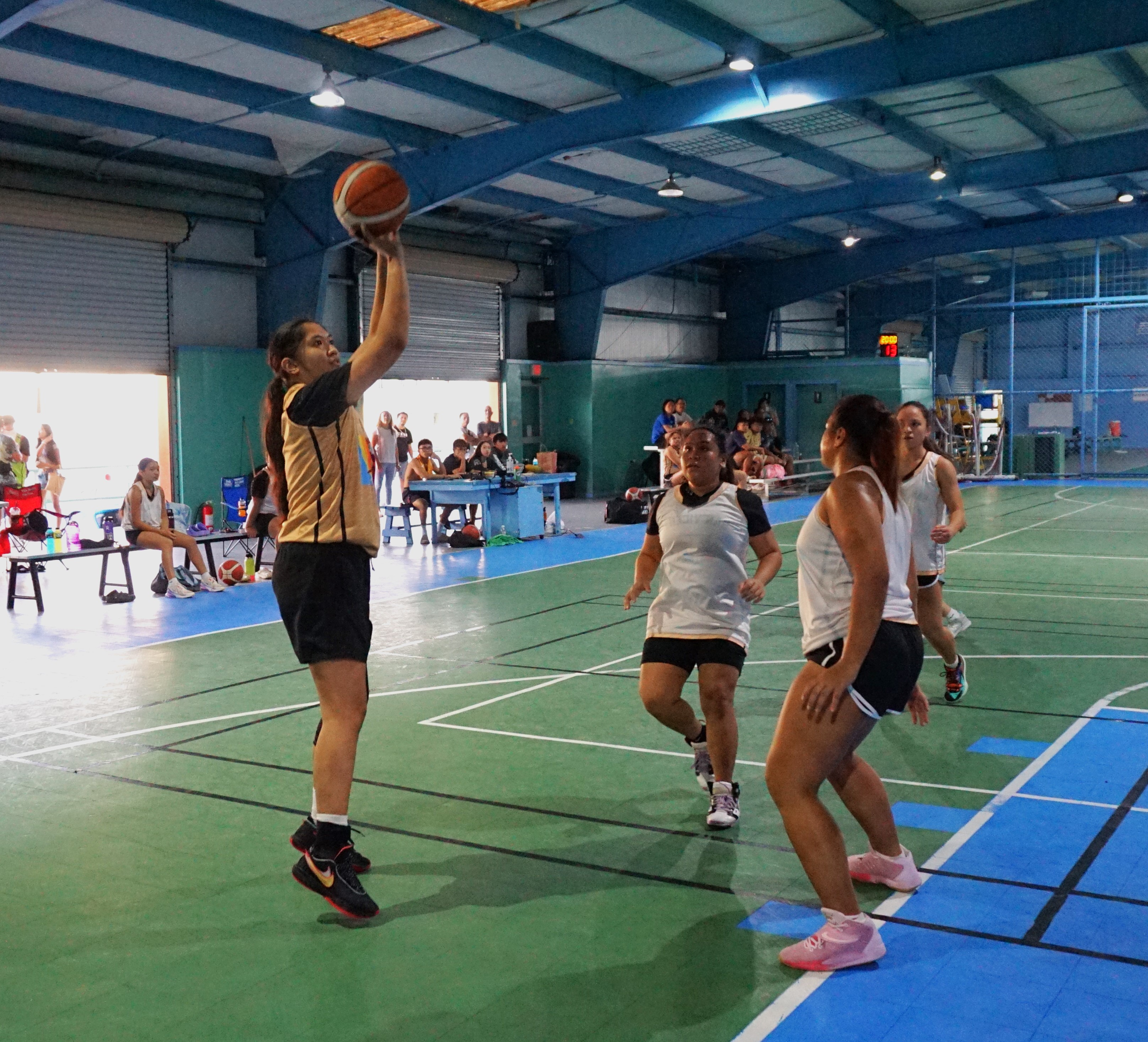 Garapan's Madeleine Alegre pulls up for the corner jumper shot during a women's division semifinal game of the 2022 Marianas Village Pride Basketball League at the TSL Sports Complex on Saturday.