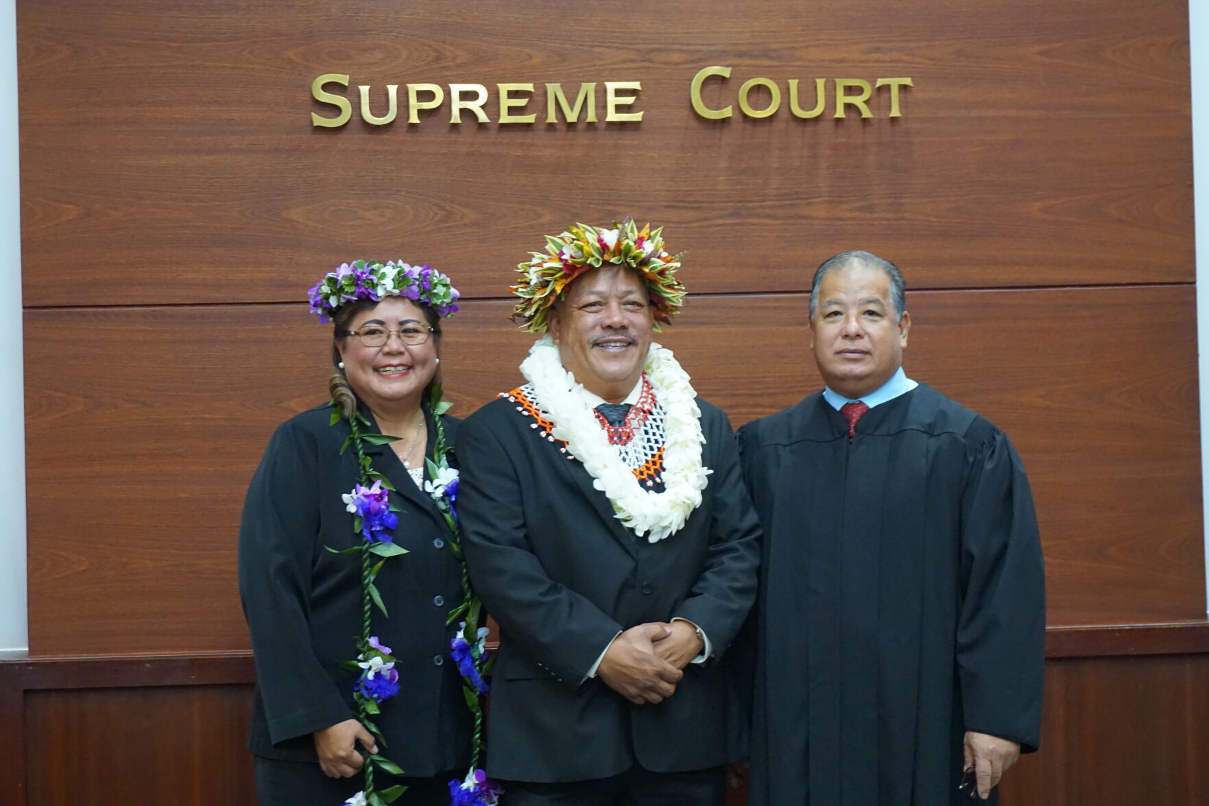 Tinian Mayor Edwin P. Aldan poses for a photo with his wife and Associate Justice Perry B. Inos
