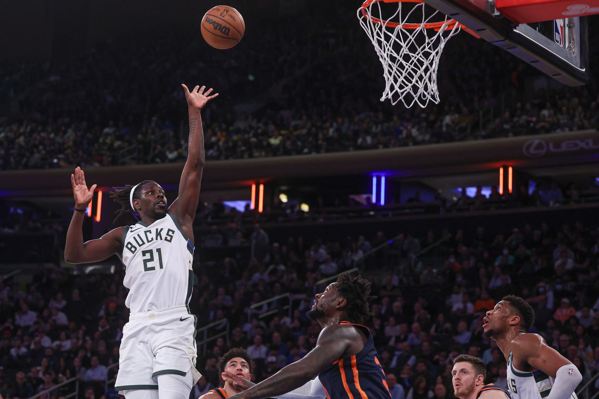 Milwaukee Bucks guard Jrue Holiday (21) shoots the ball against New York Knicks forward Julius Randle (30) during the during the third quarter at Madison Square Garden in New York on Jan. 9, 2023.