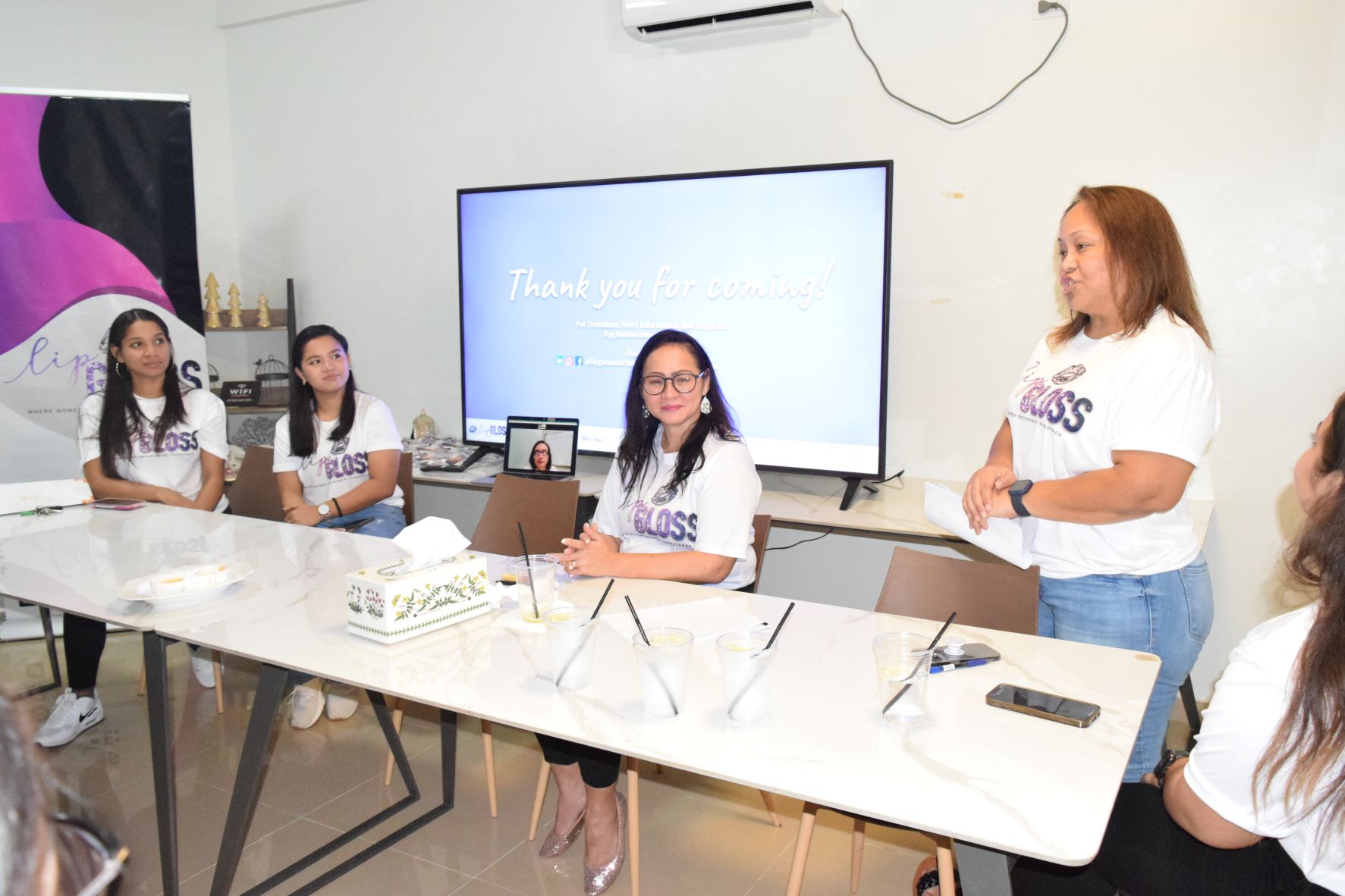 Lip Gloss President Frances Santos, second right, speaks  during a table discussion about women empowerment as CEO Maryann Borja, center, Vice President Dasha Camacho, left, Treasurer Hazel Nicole Sadian, second left, and Secretary Tiana Villagomez, right, listen.