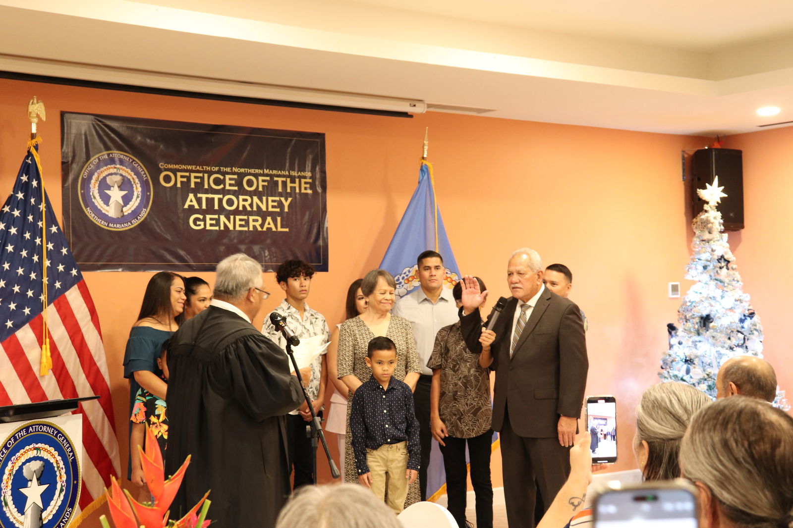 Superior Court Presiding Judge Roberto C. Naraja, left, administers the oath of office to Attorney General Edward Manibusan at the Crowne Plaza Resort Saipan on Saturday.  
