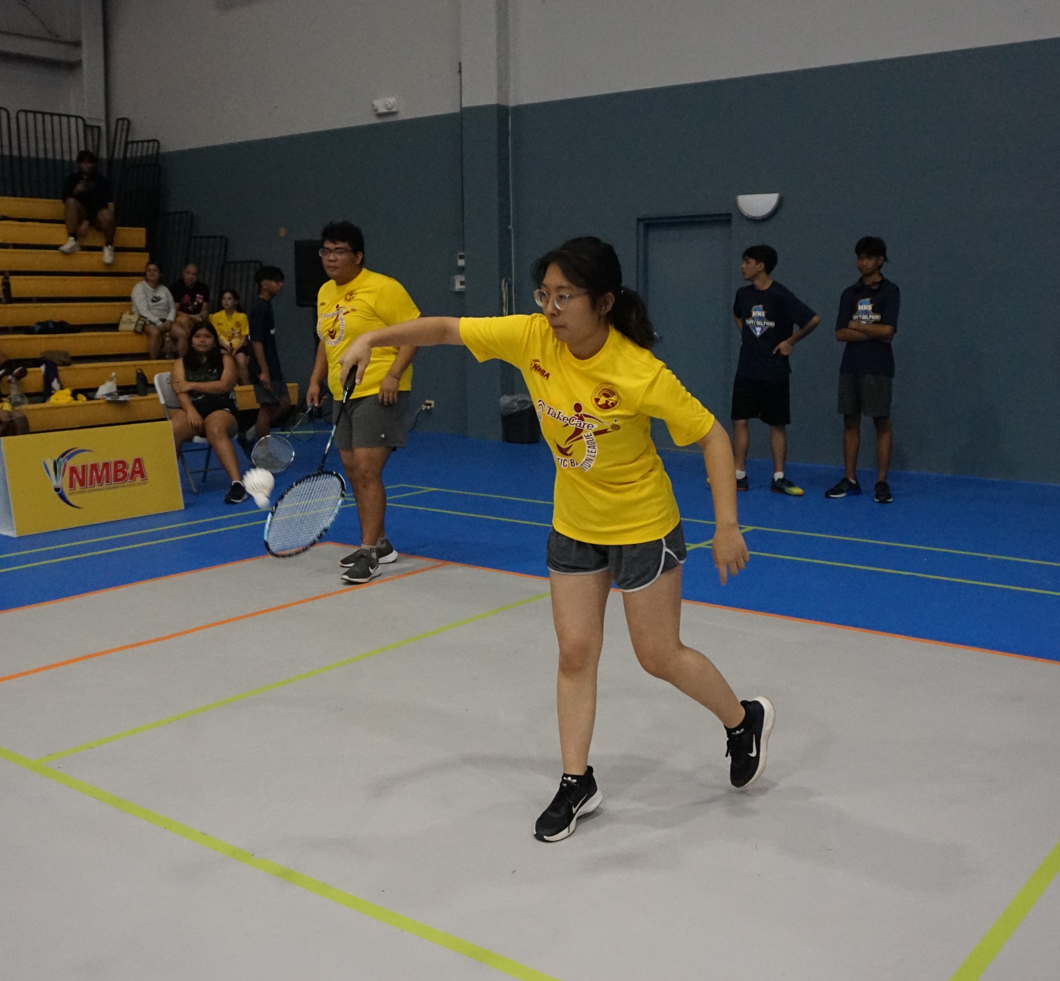An SSHS player reaches for the backhand return during a mixed doubles event of the TakeCare-PSS Interscholastic Badminton League on Saturday at the Ada gym.