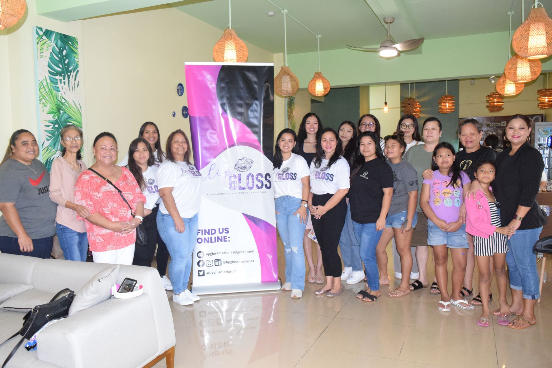 Lip Gloss Founder and Chief Executive Officer Maryann Borja, center, and board members pose for a photo with the participants of a table discussion regarding women empowerment at the Island Café & Restaurant in Garapan on Saturday.