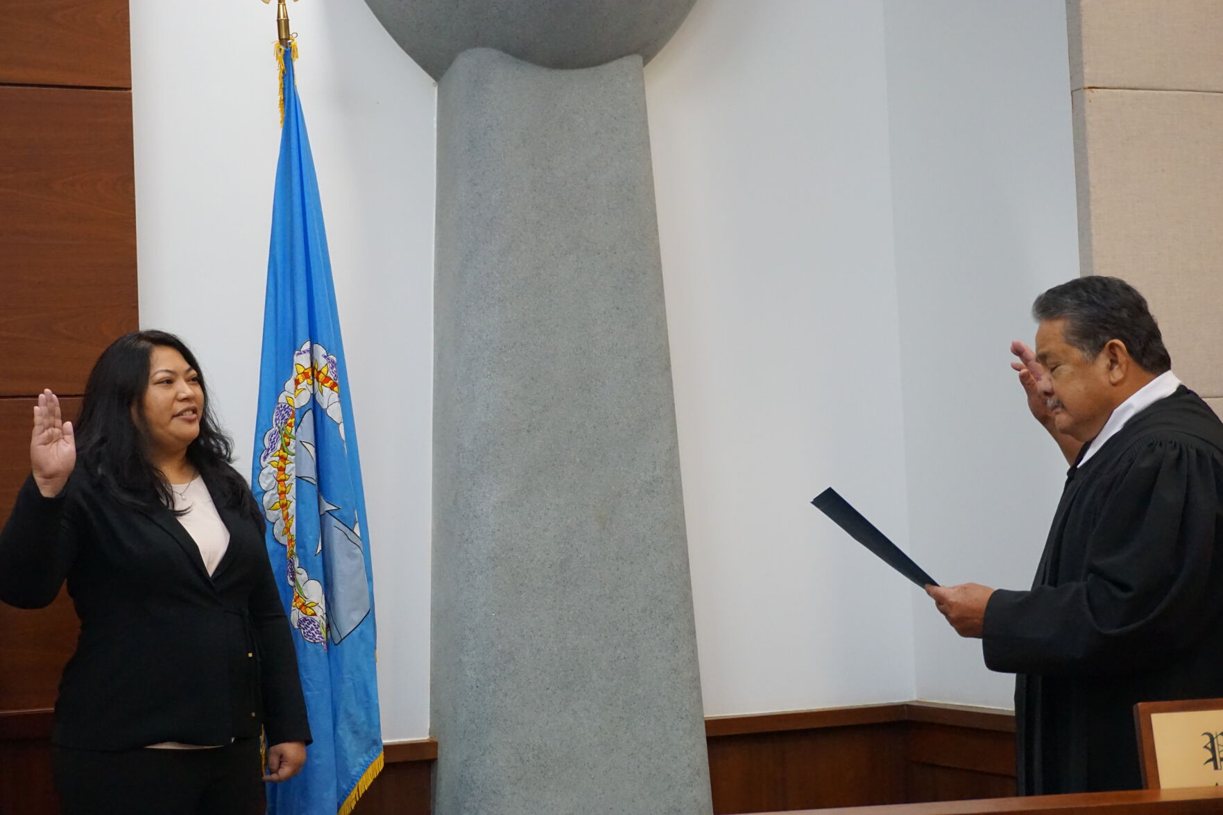 Rota Mayor Aubry Manglona Hocog is sworn in by Chief Justice Alexandro Castro at the Guma Hustisia on Monday morning.