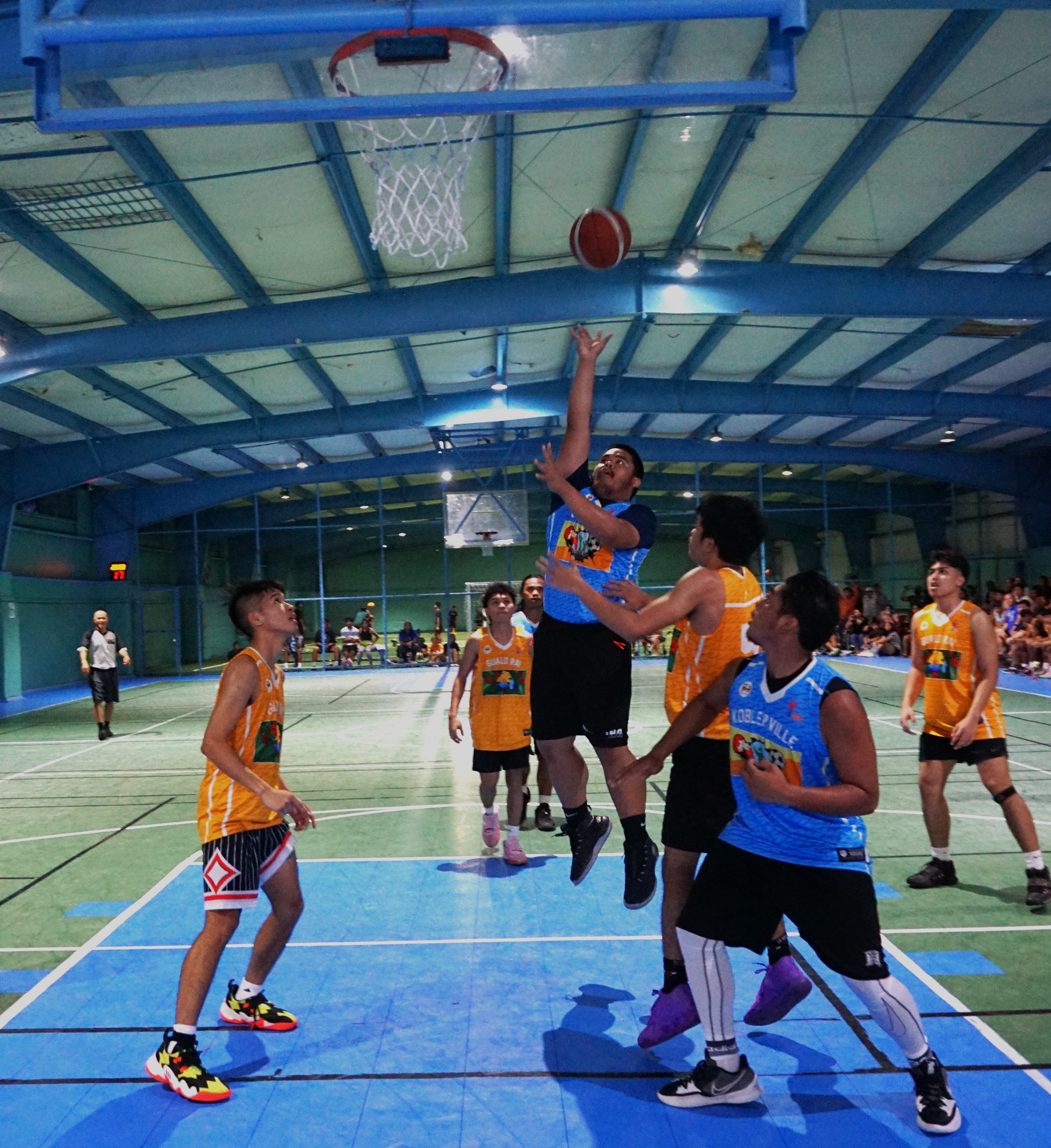 Koblerville's Matthew Lucas extends for the finish during the U18 boys division championship game of the 2022 Marianas Village Pride Basketball League on Sunday at the TSL Sports Complex.